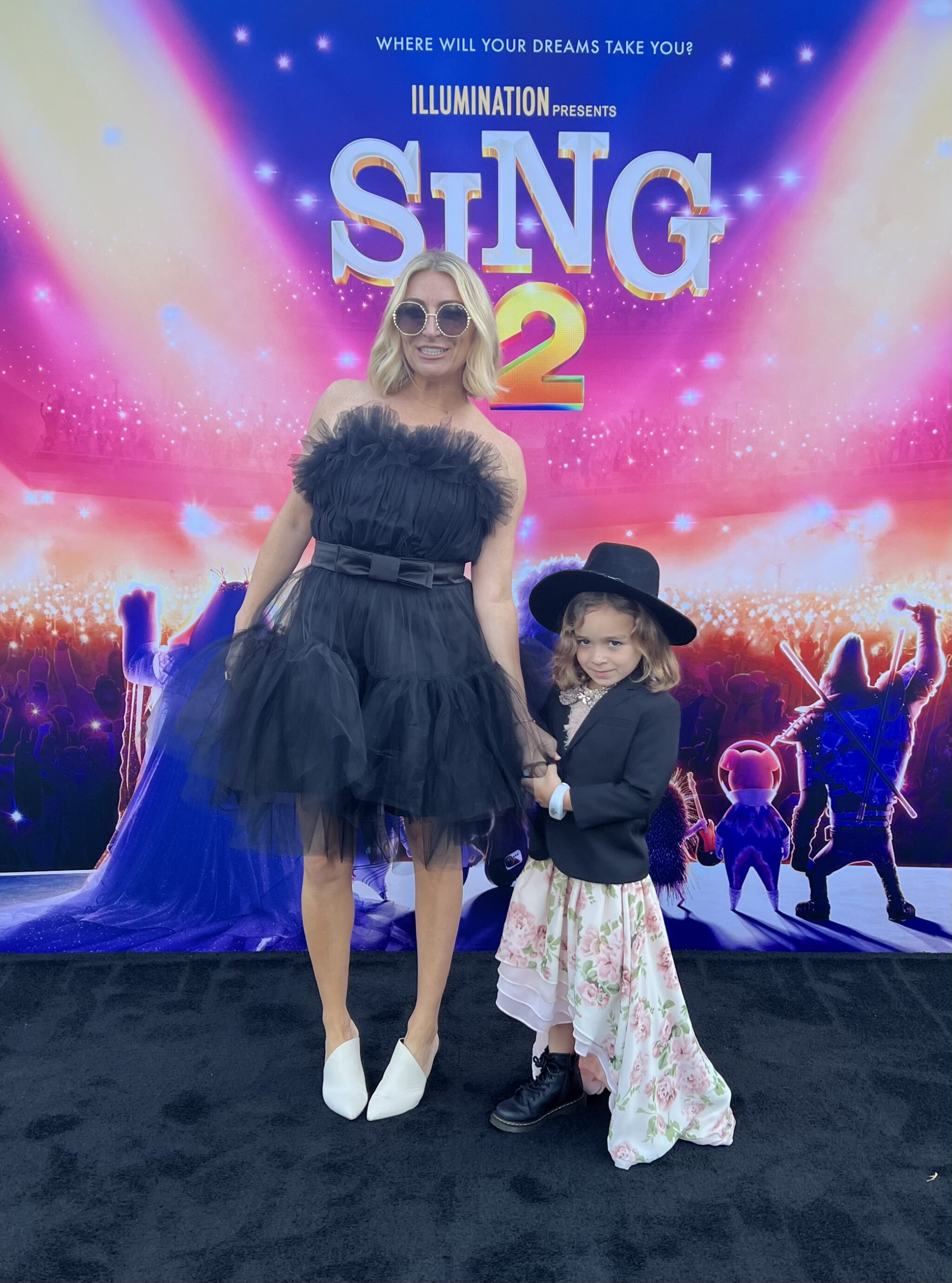 mom and son on red carpet at sing 2 premiere