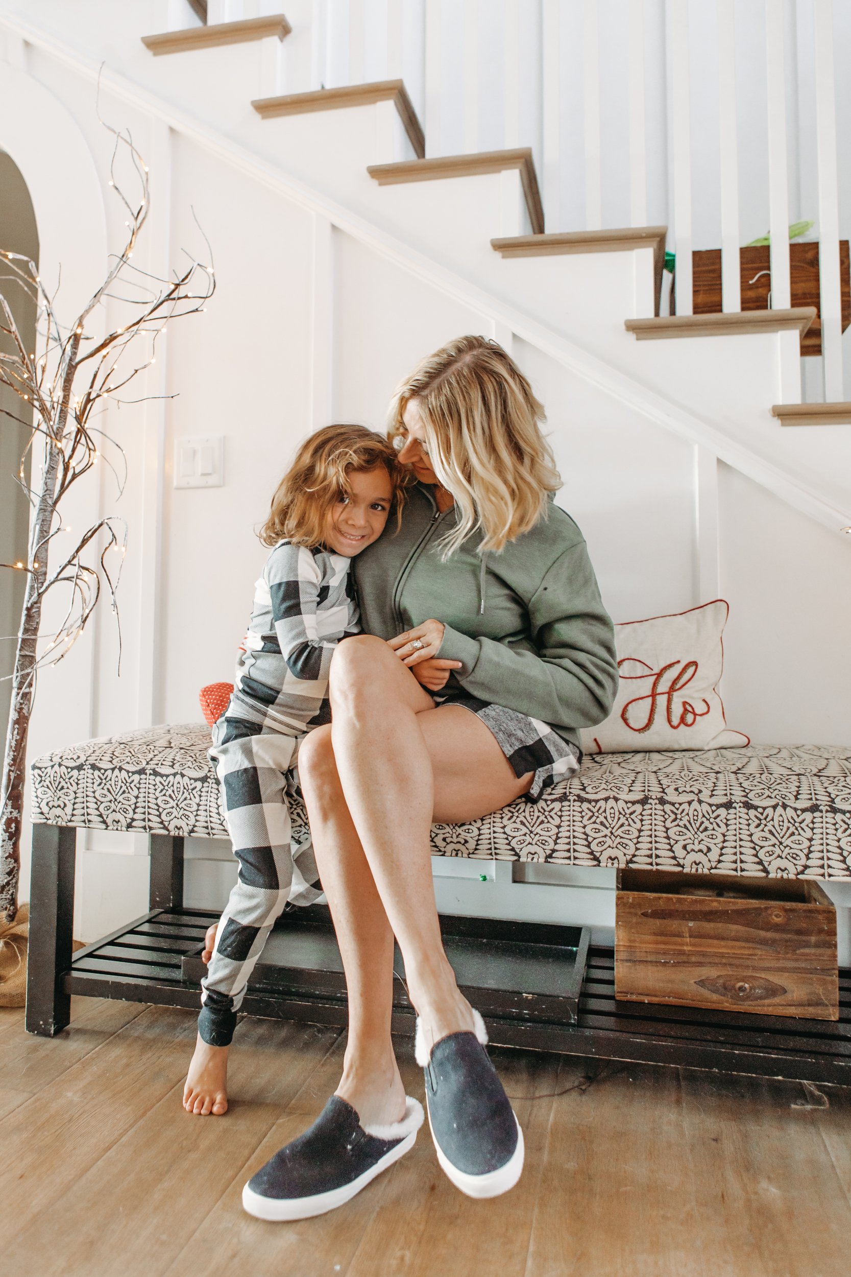 mom and son cuddling in pajamas