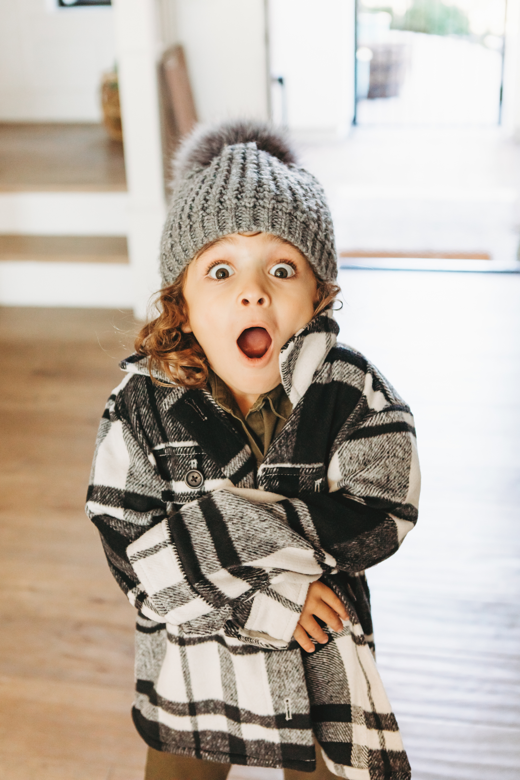 little boy looking surprised in winter jacket