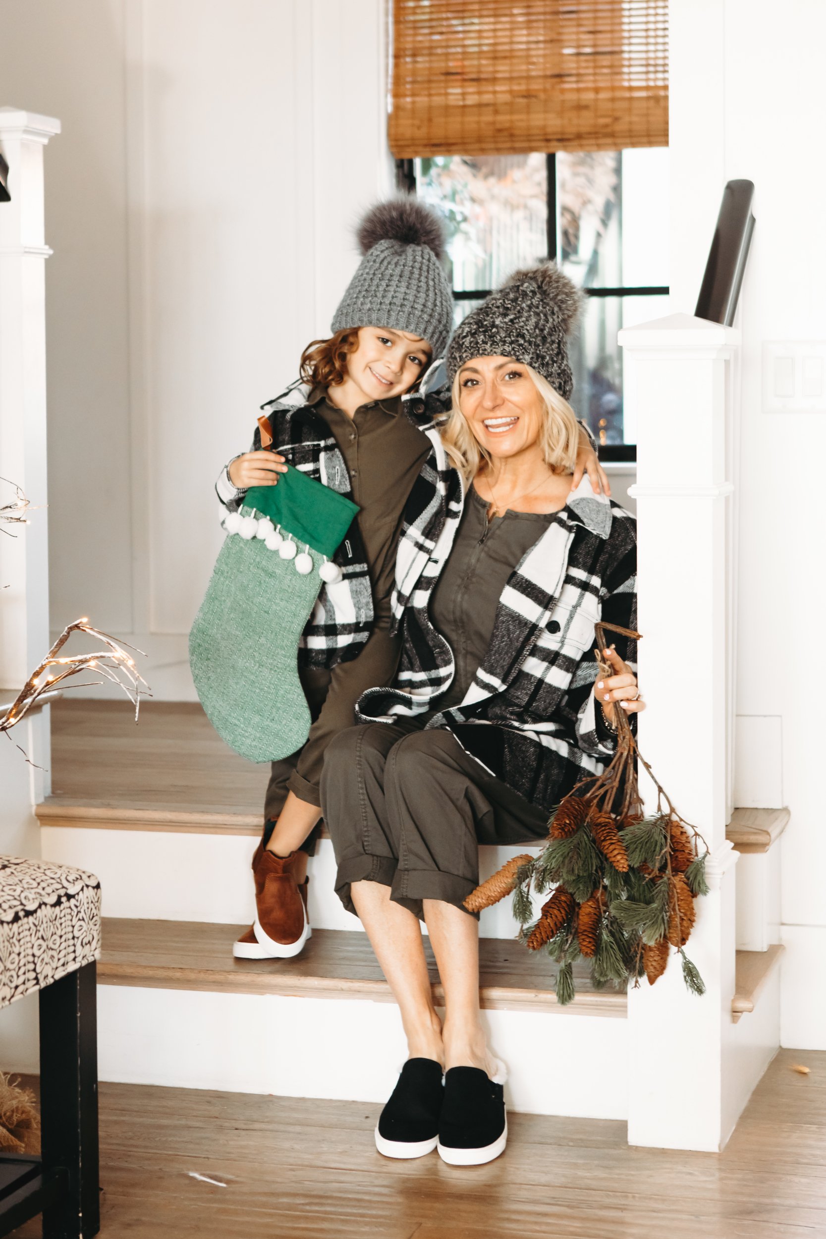 mom and boy sitting on stairs