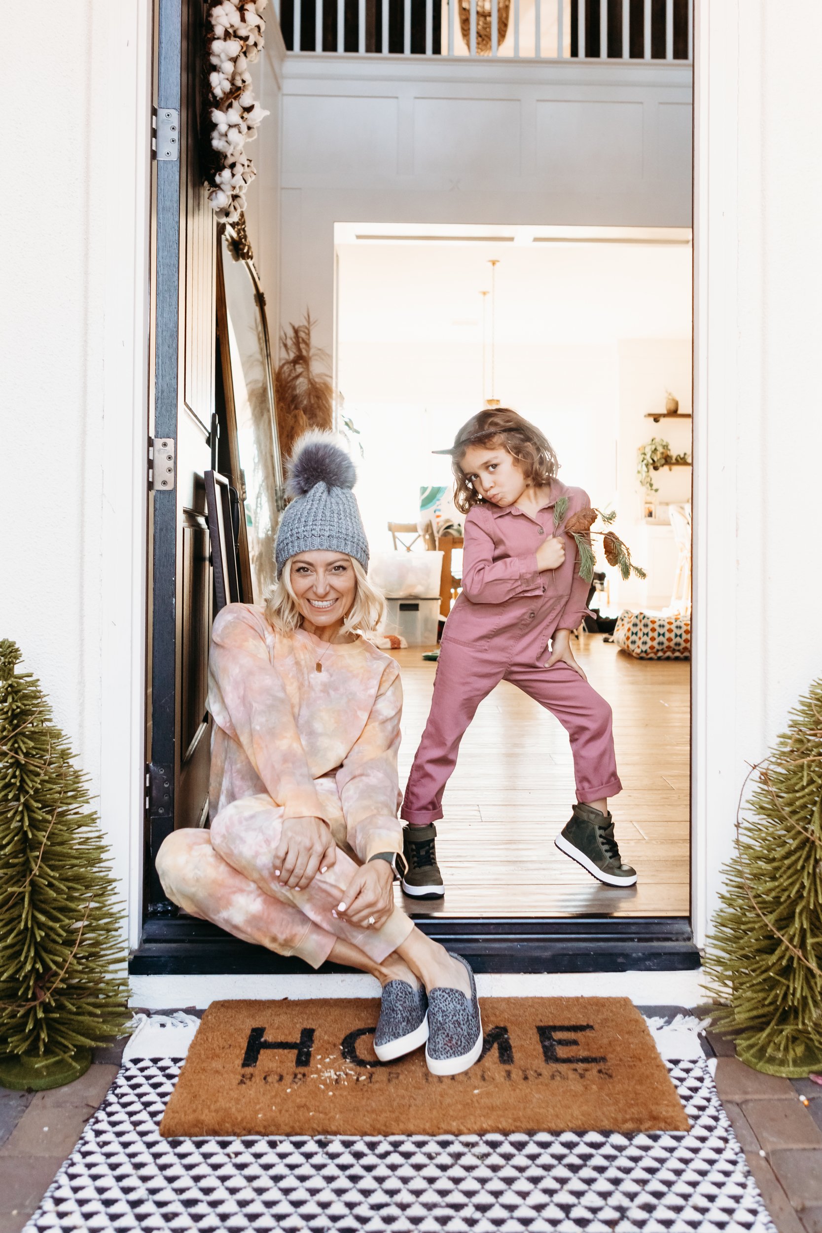 mom and child sitting in doorway