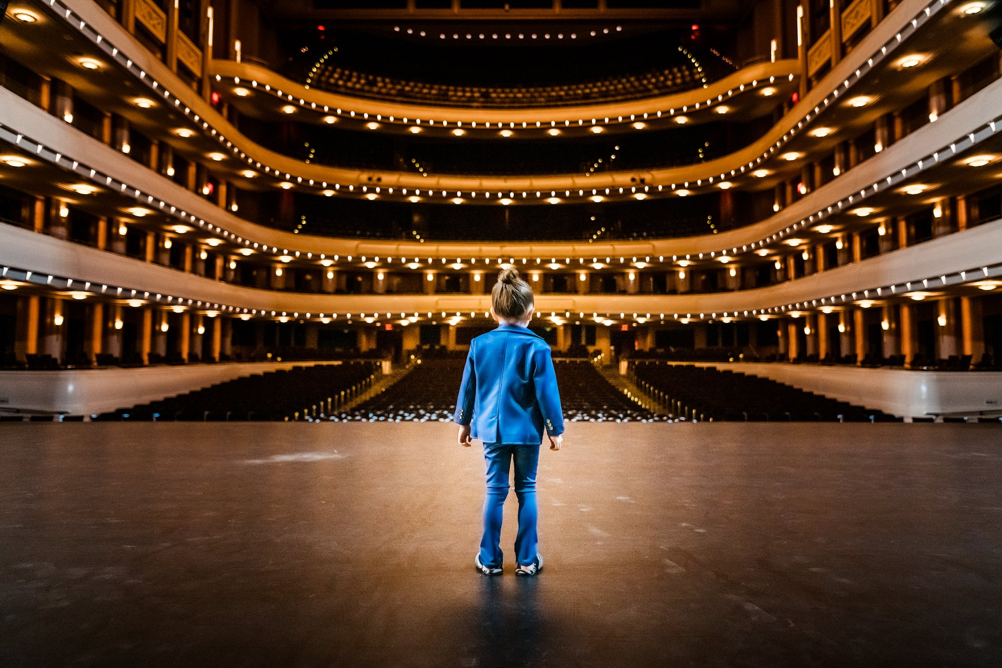 boy standing on stage