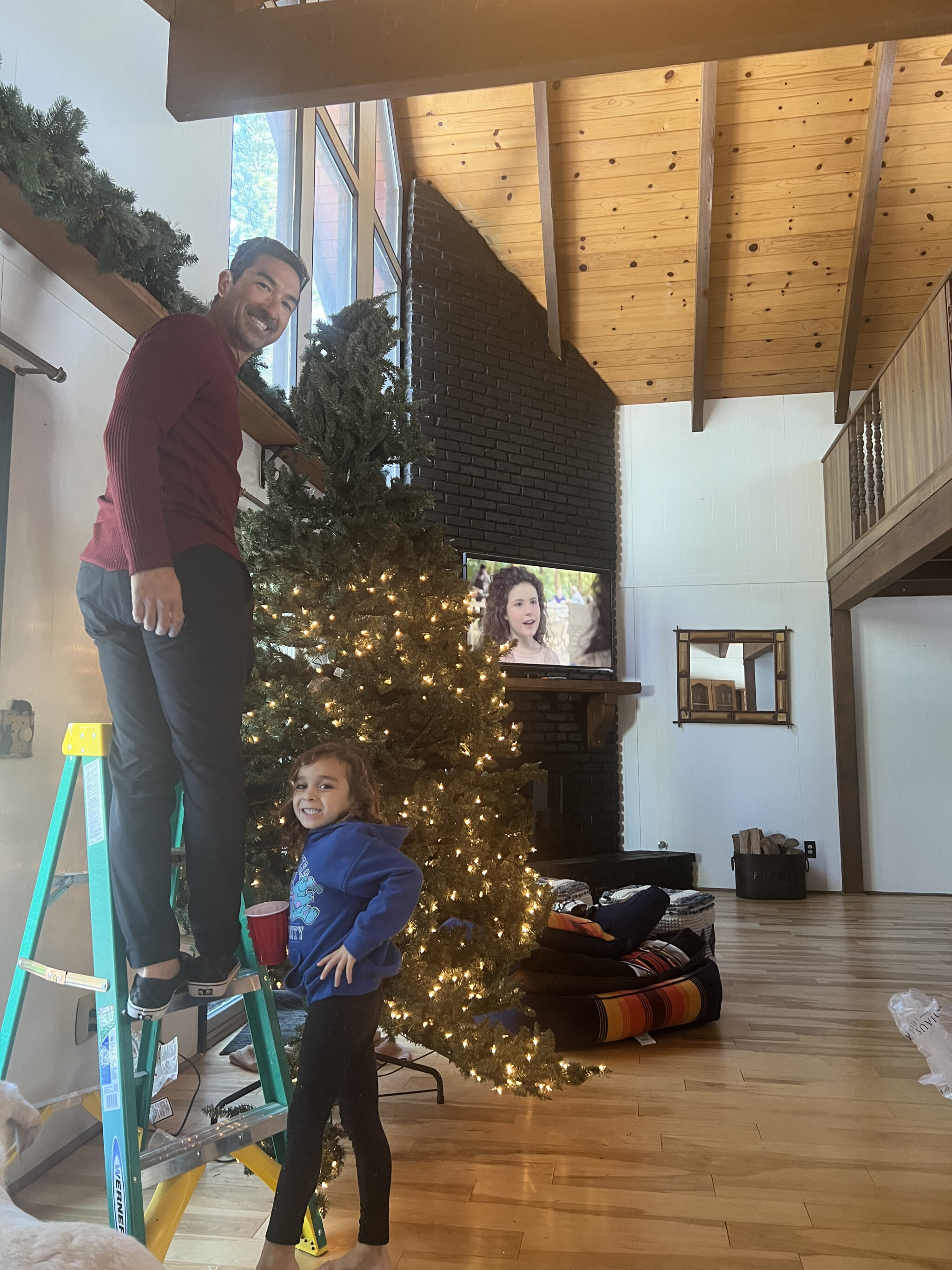 father and son decorating the tree