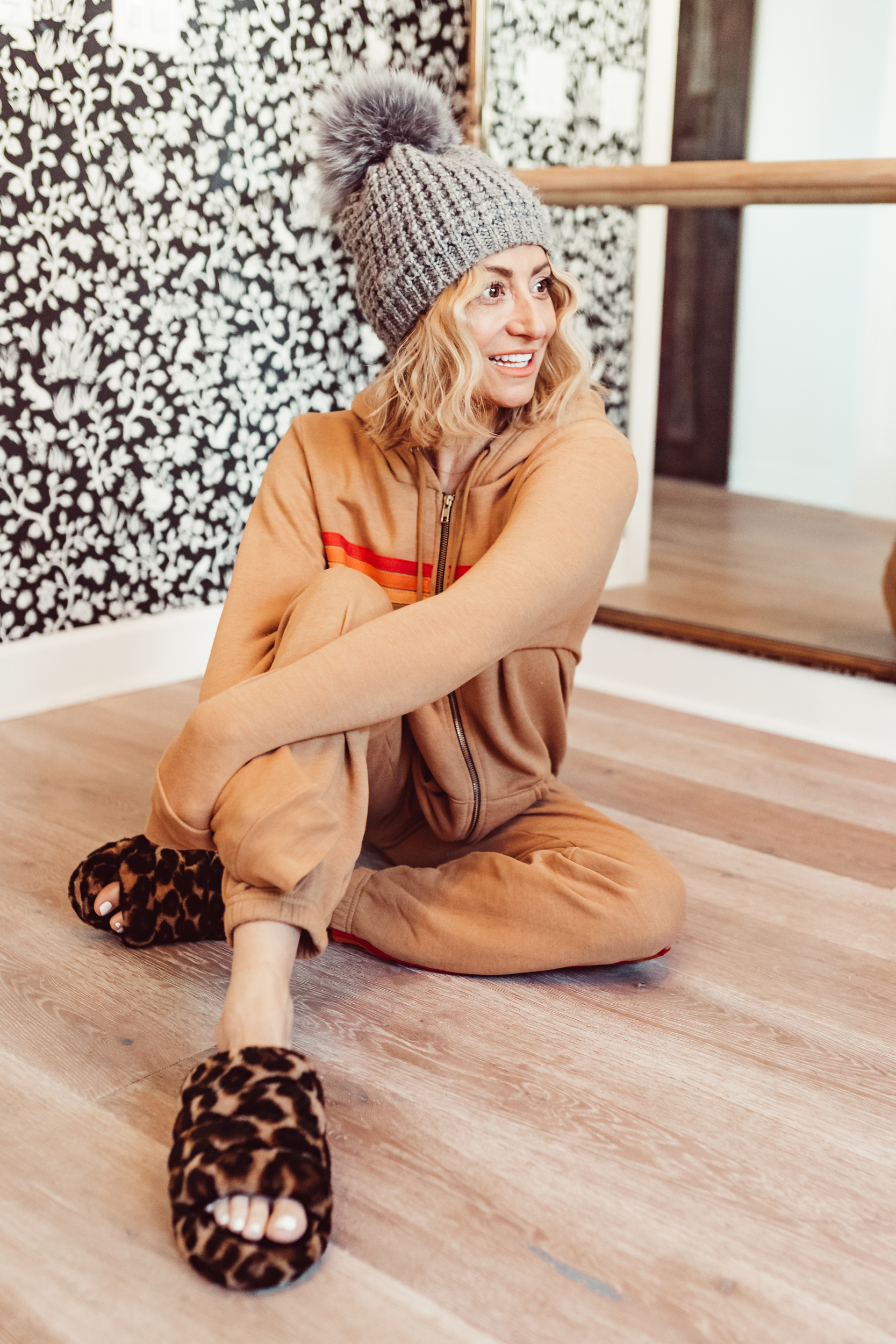 woman sitting on floor in sweatpants