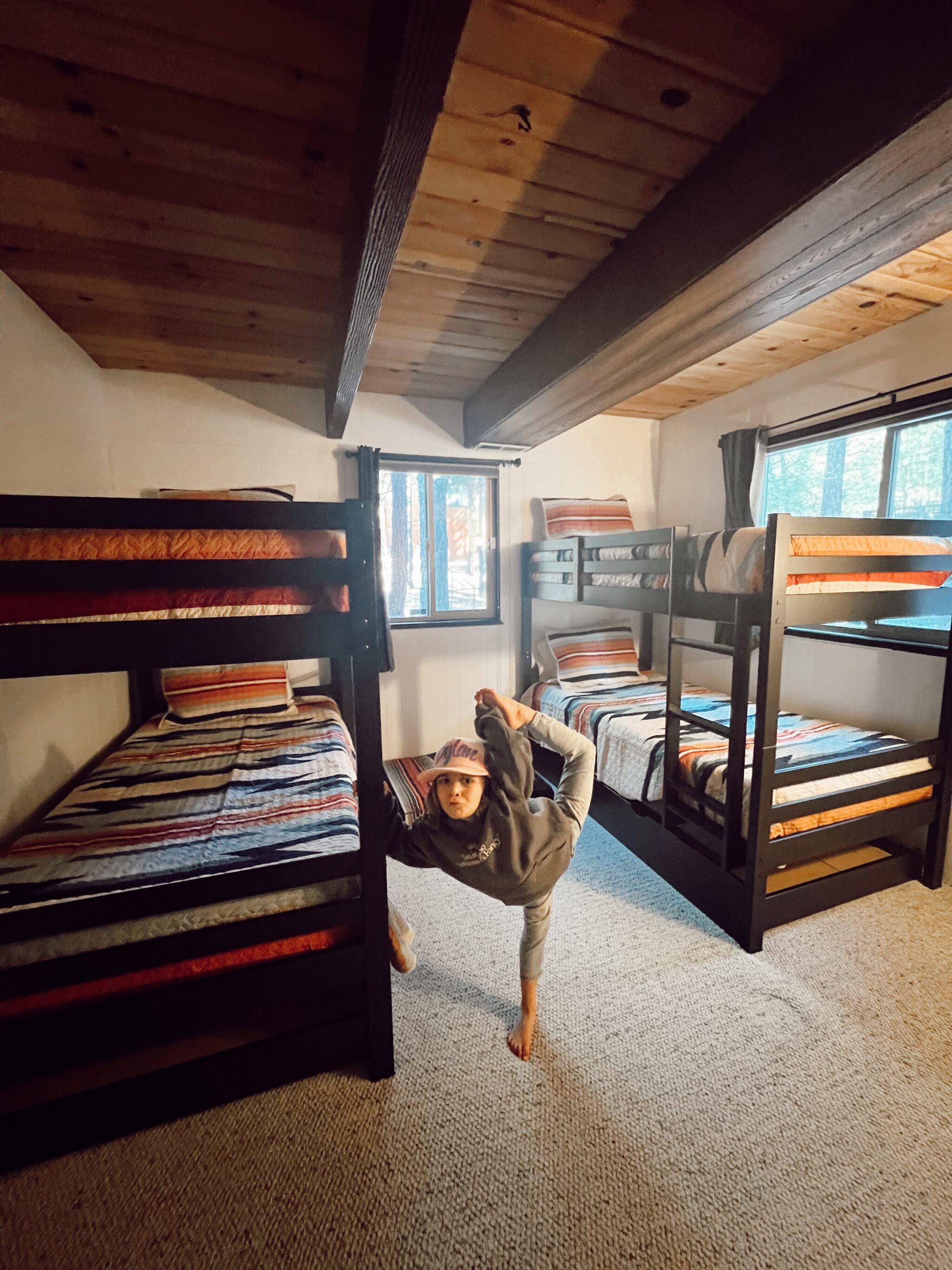 kid dancing by bunk beds