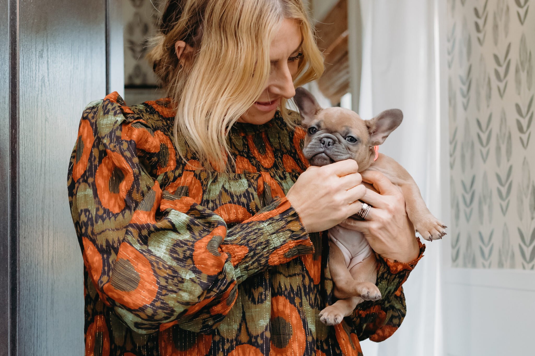 woman holding puppy