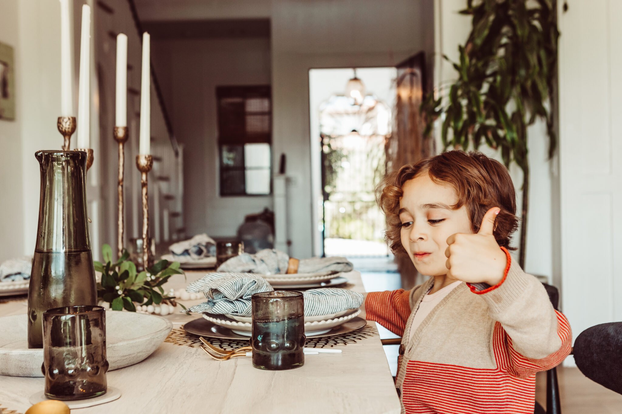 boy sitting at dinner table