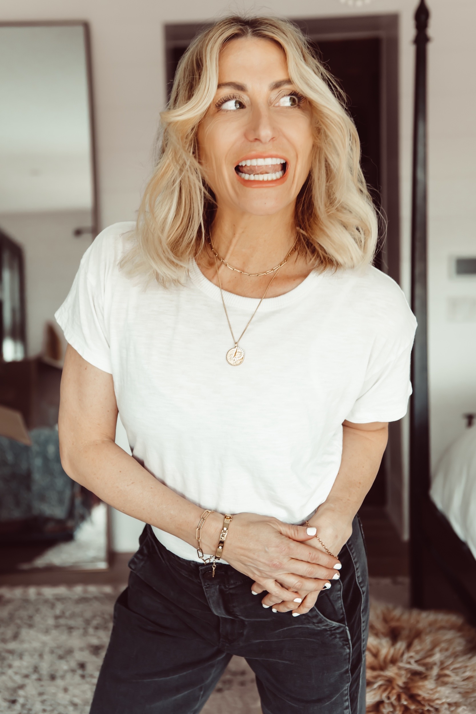 woman smiling in white tee