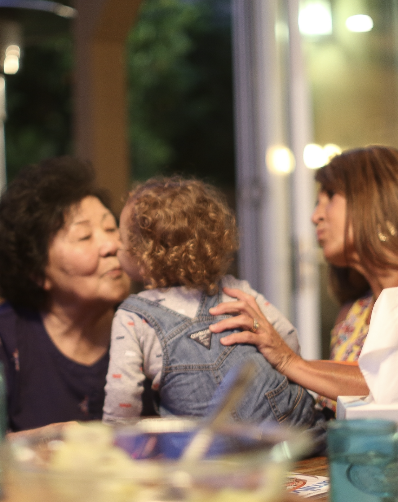 grandma kissing her grandson