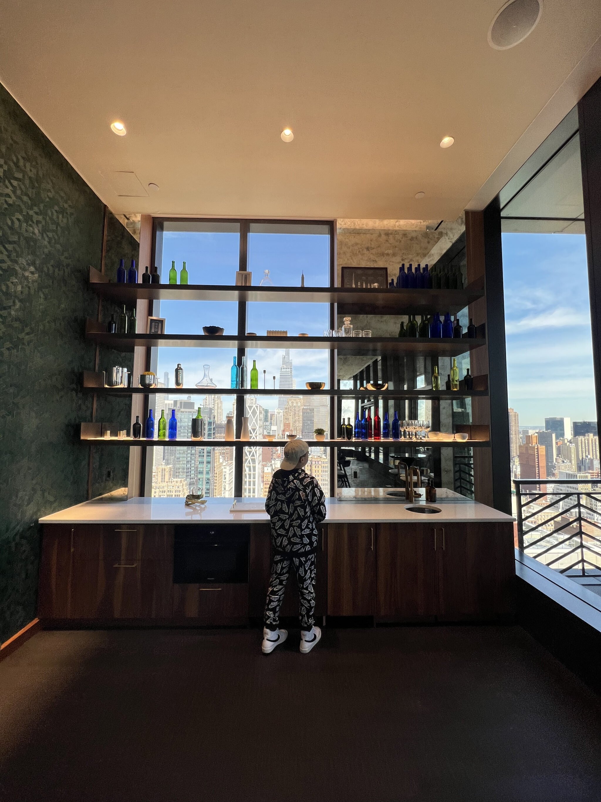 kid standing in front of shelves