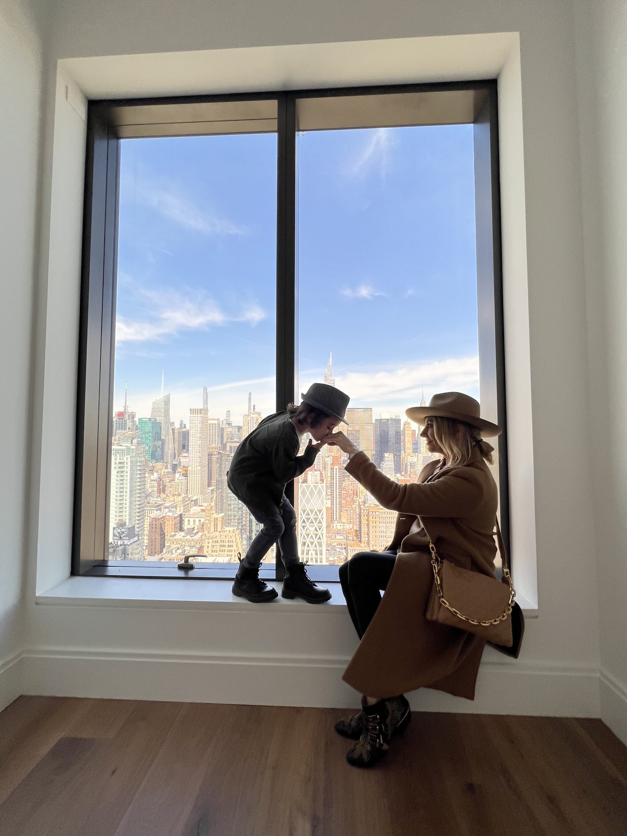 boy kissing mom's hand