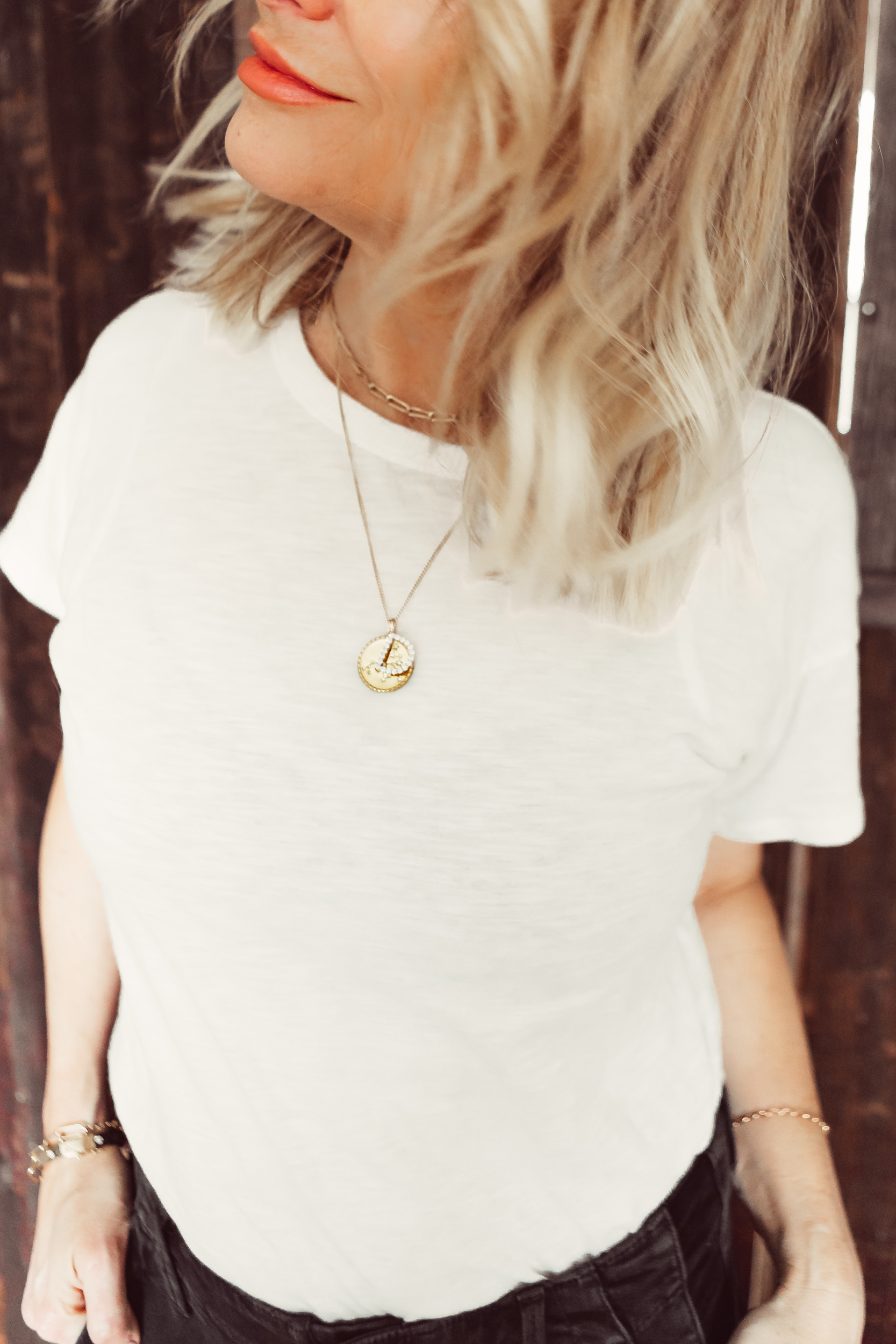 necklace on white shirt