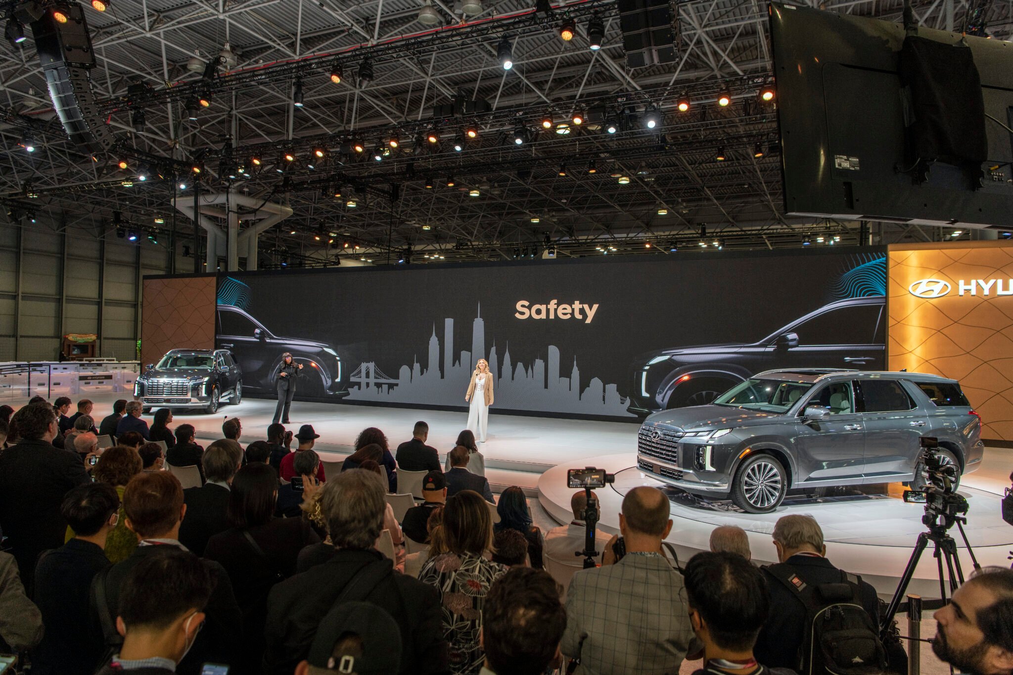 woman presenting at auto show