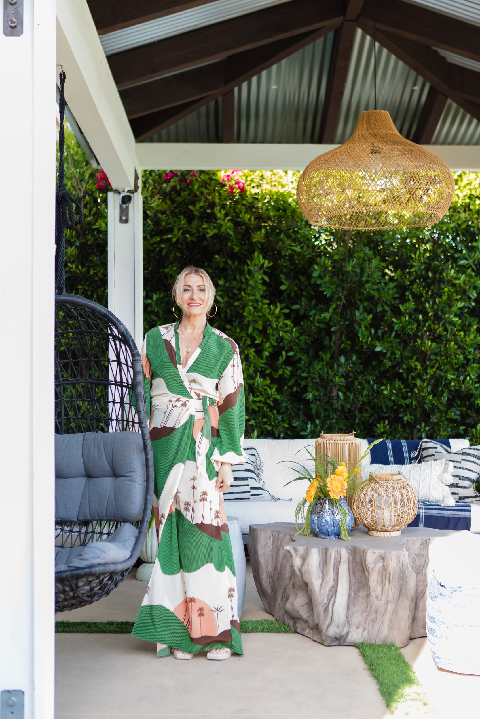 woman standing on outdoor patio