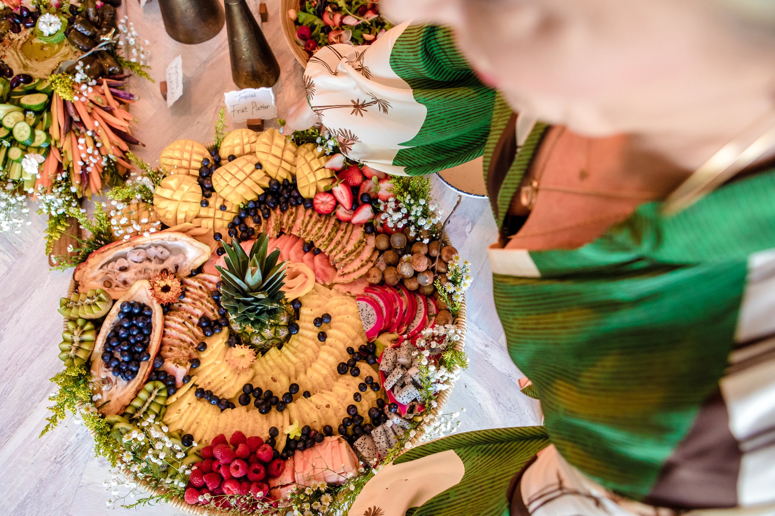 woman serving up platters of food