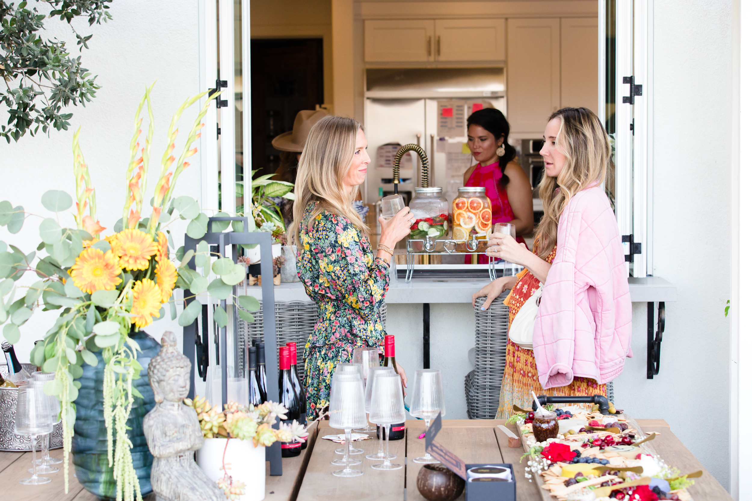 women standing outside at party