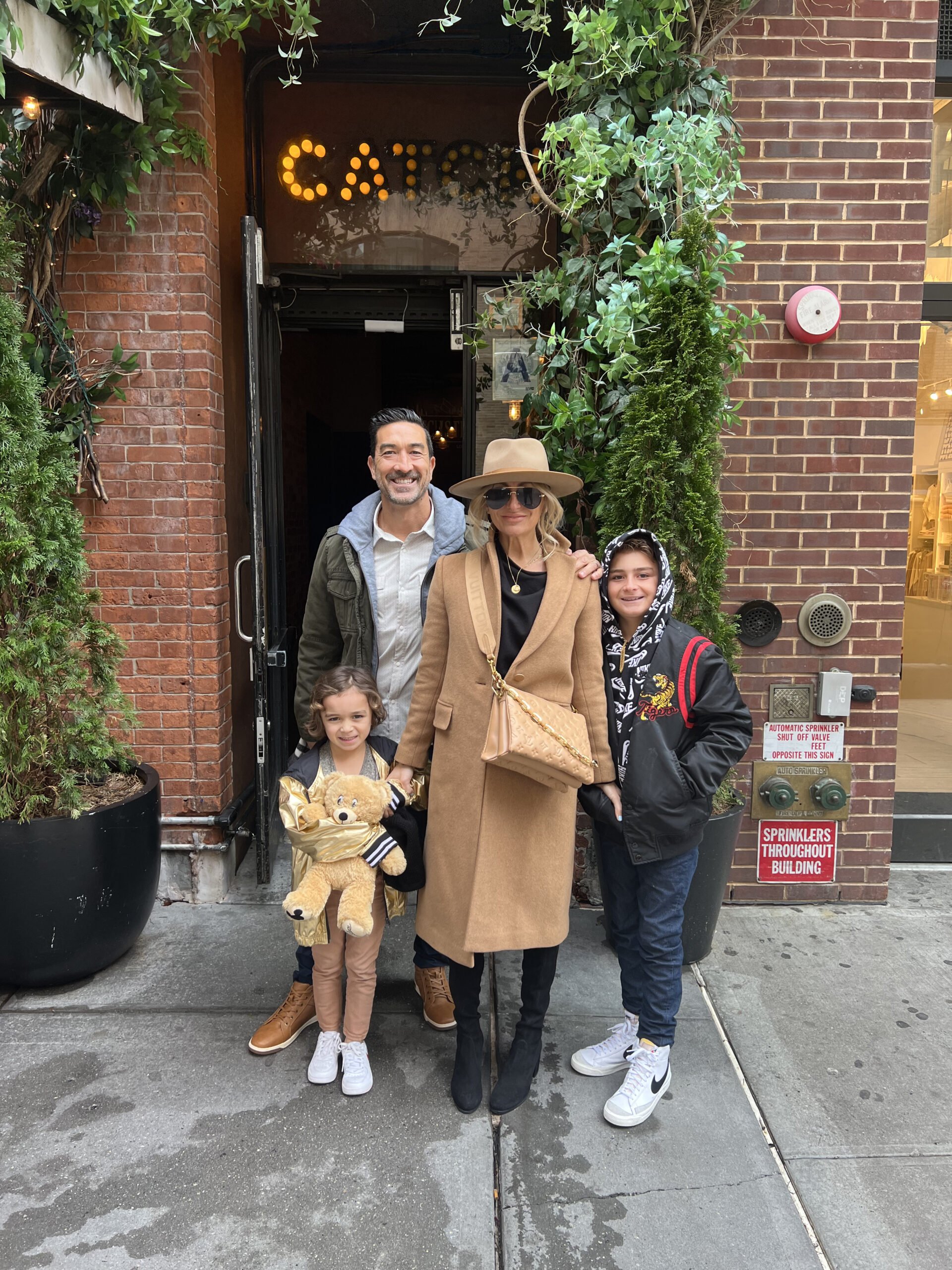 family outside a restaurant in nyc