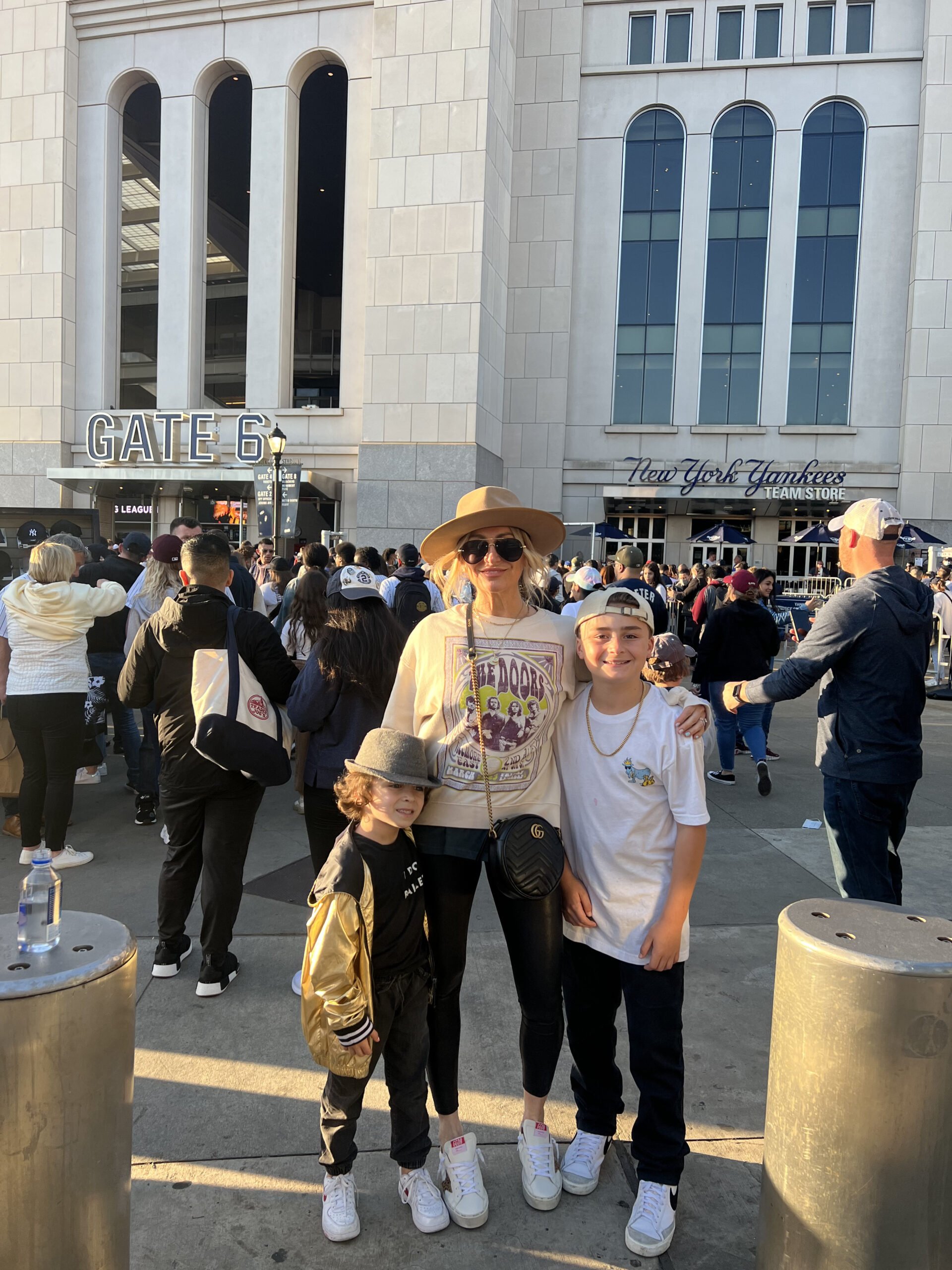 mom with sons at a stadium