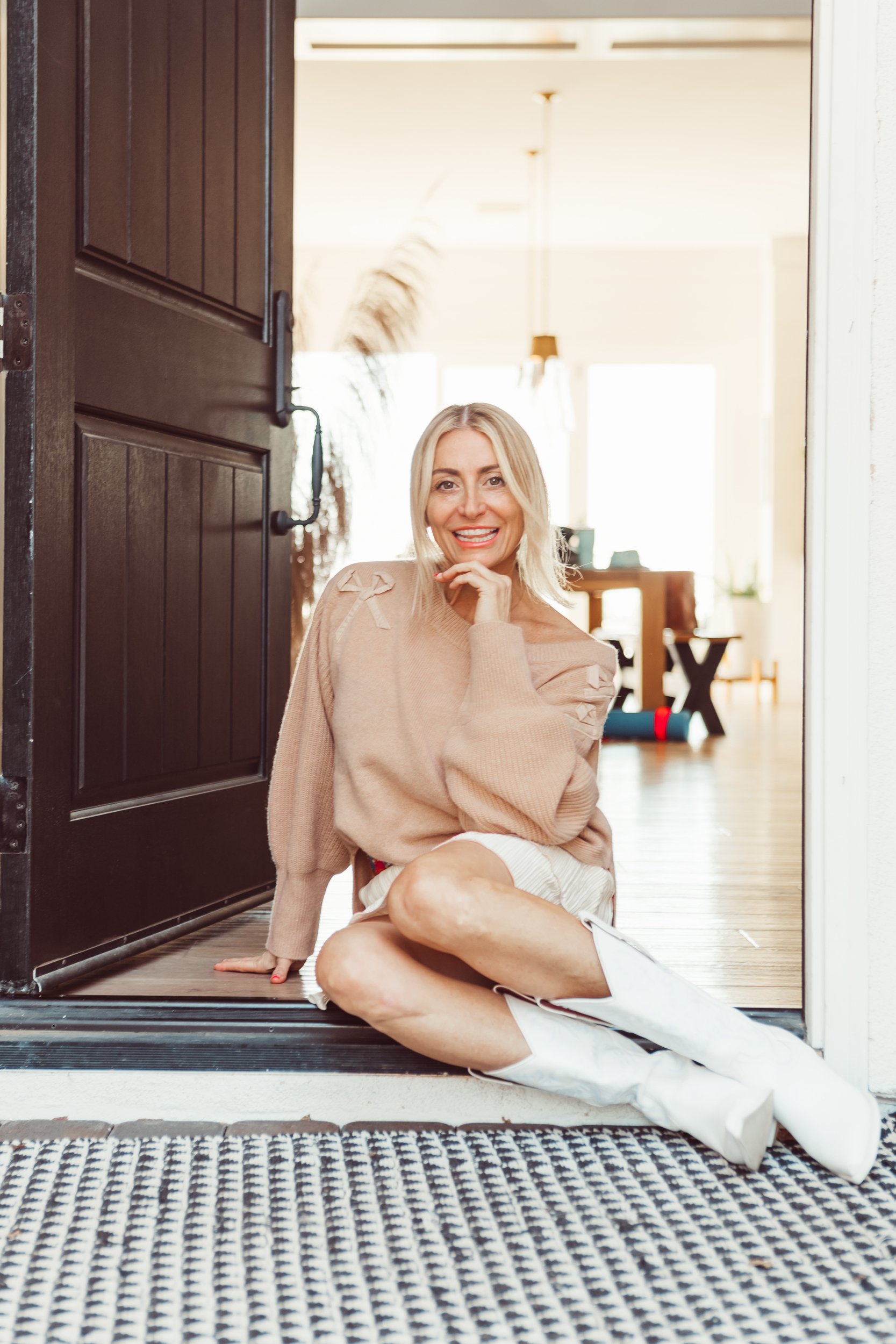 woman sitting in a doorway