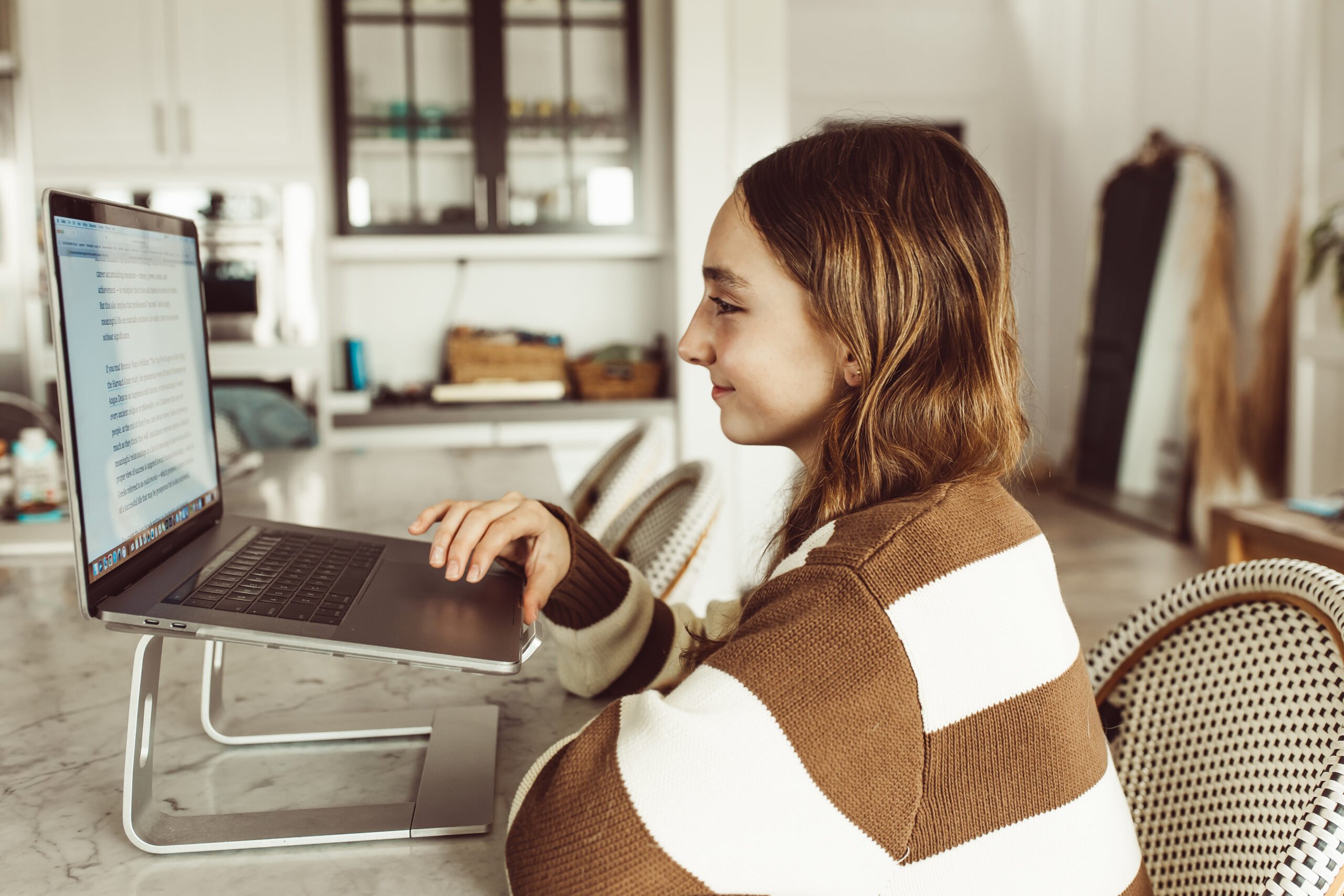 girl studying on laptop