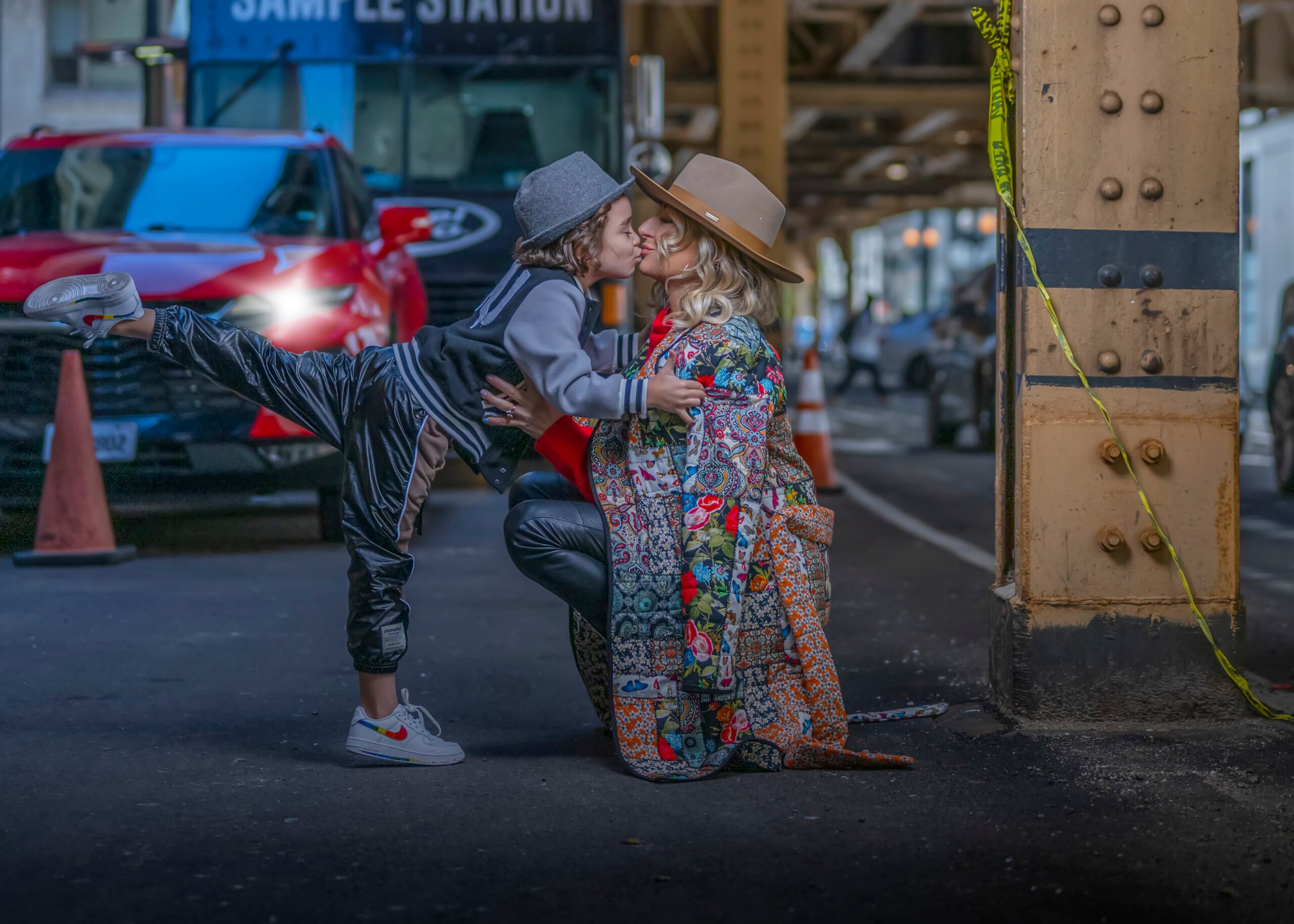 boy giving his mom a kiss