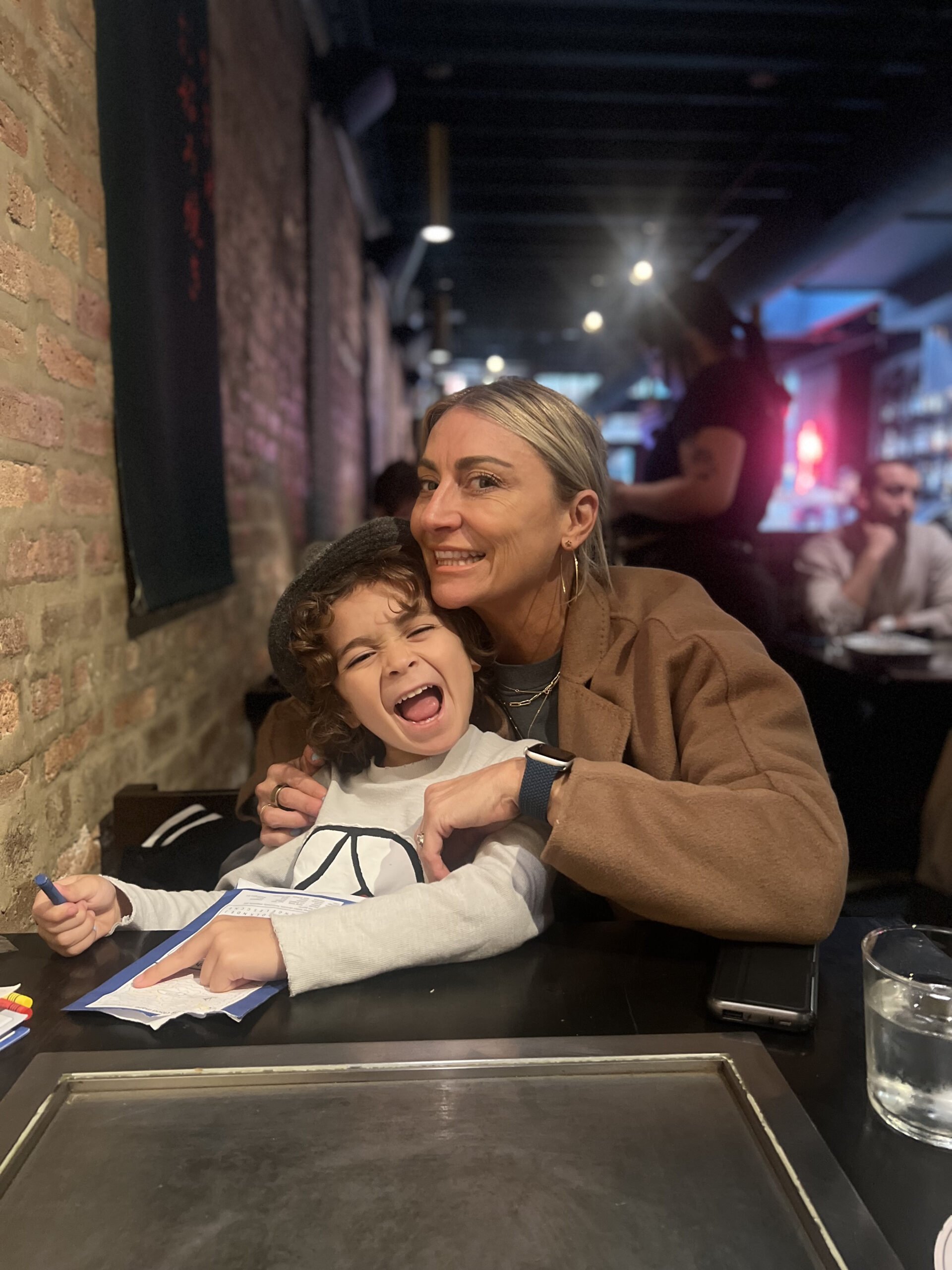 mom and son in restaurant