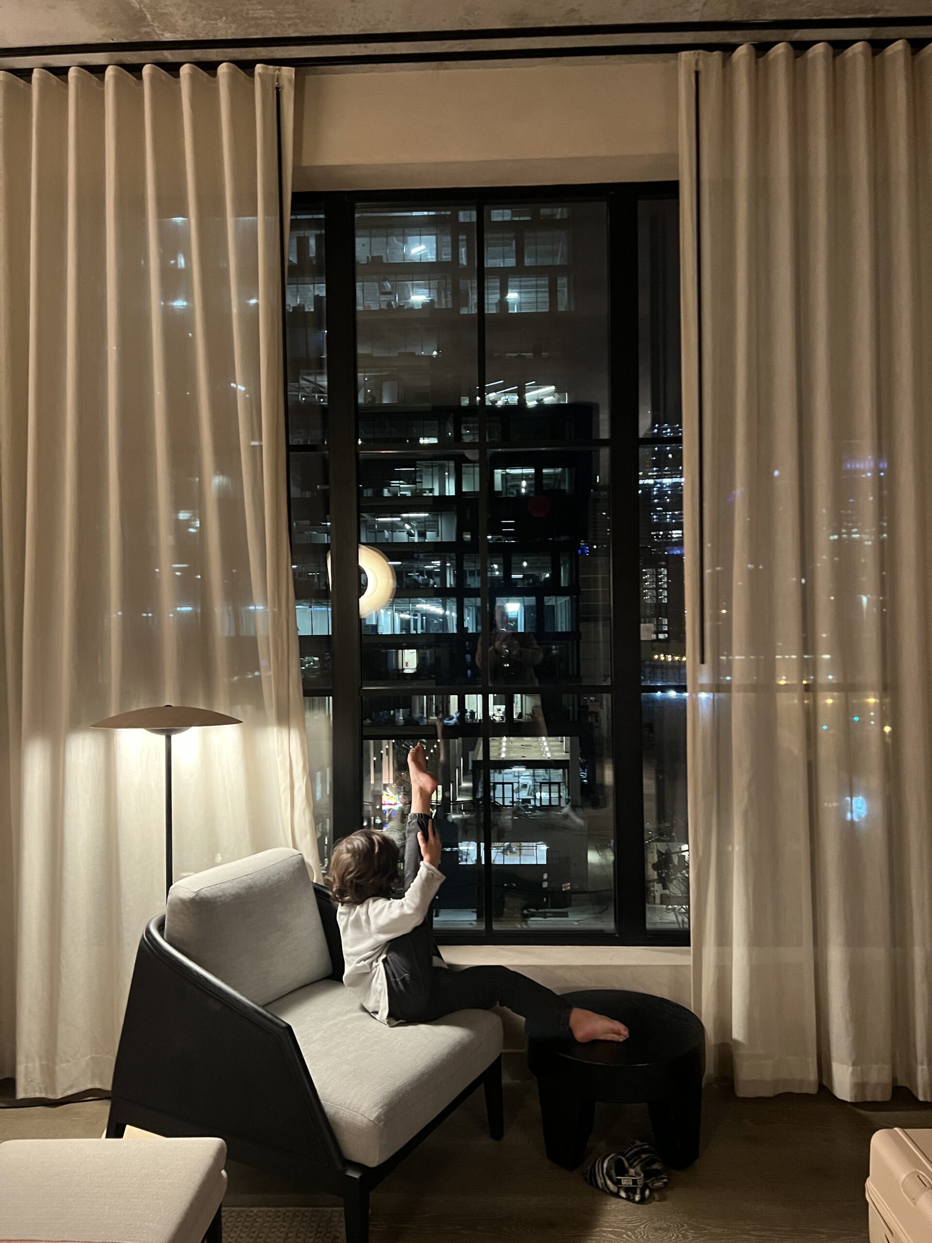 boy dancing in hotel room