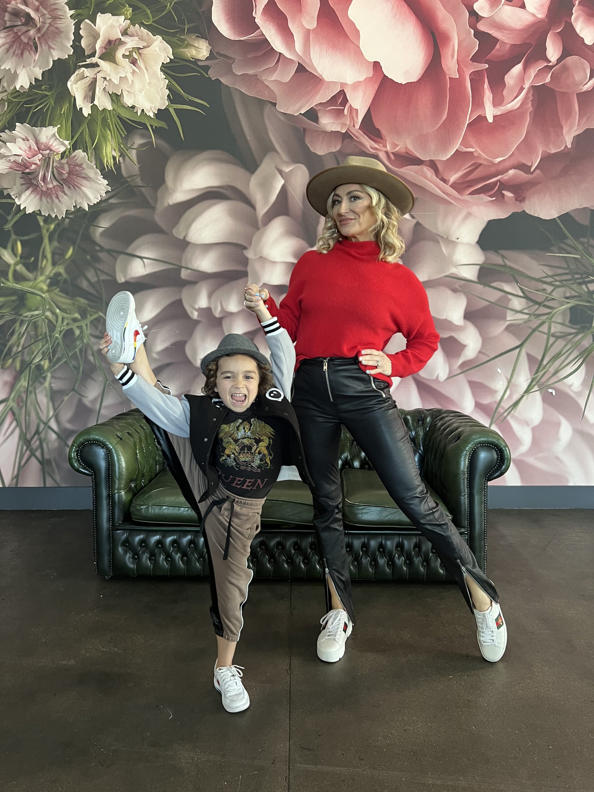 mom and son dancing by couch