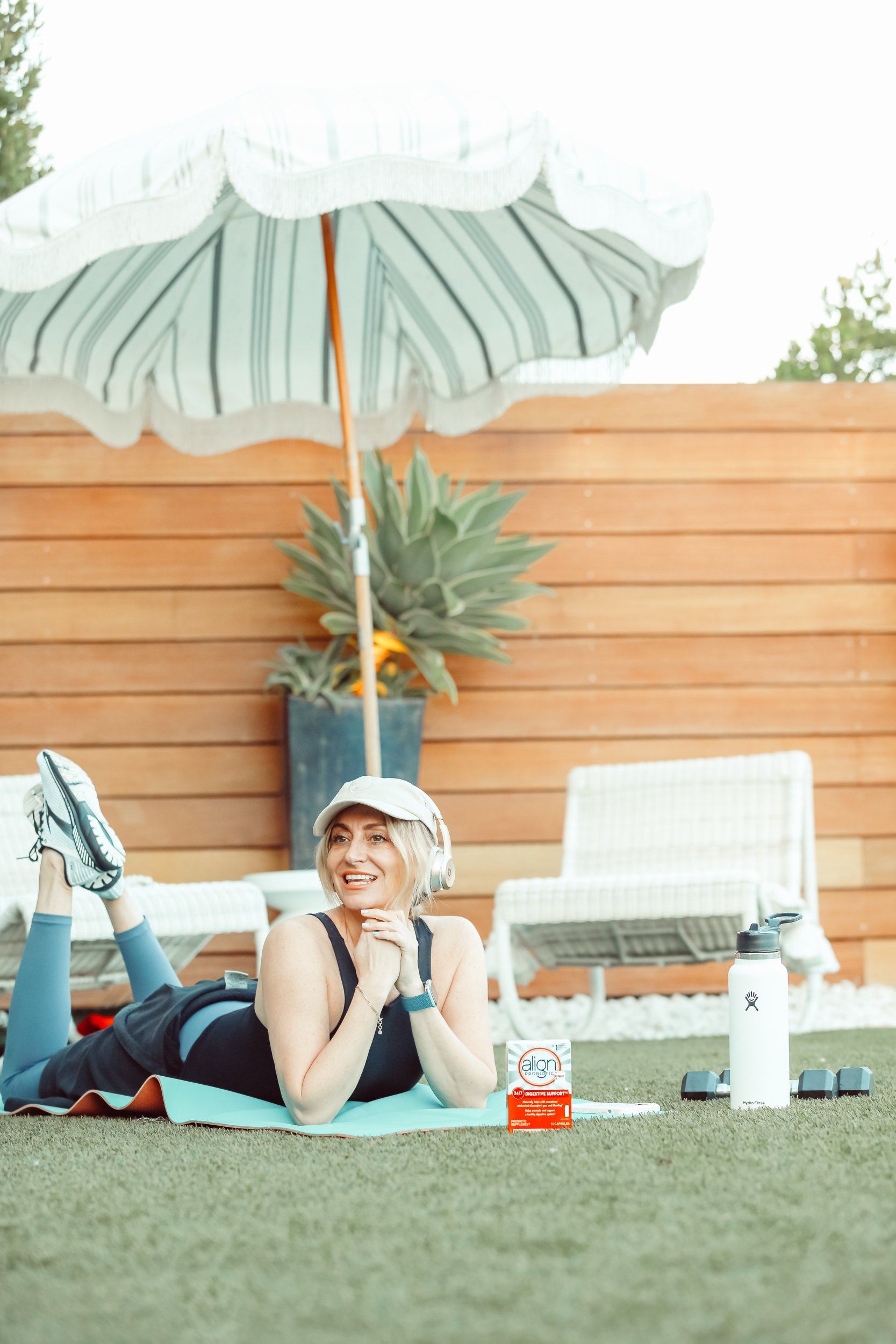 woman relaxing in backyard after workout
