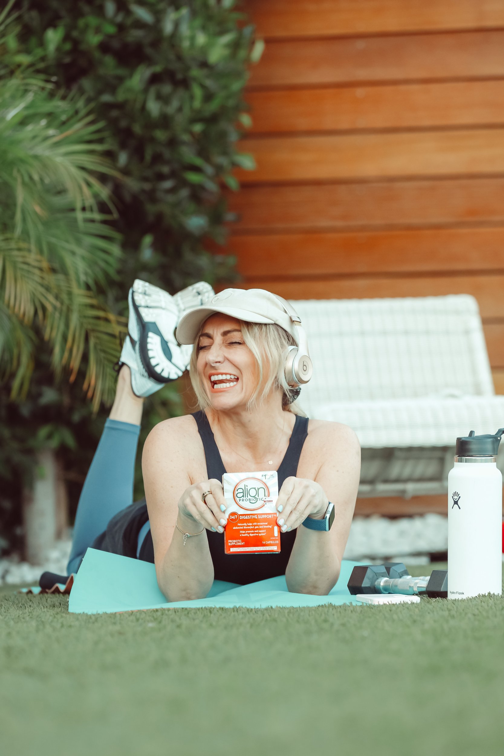 woman holding box of vitamins