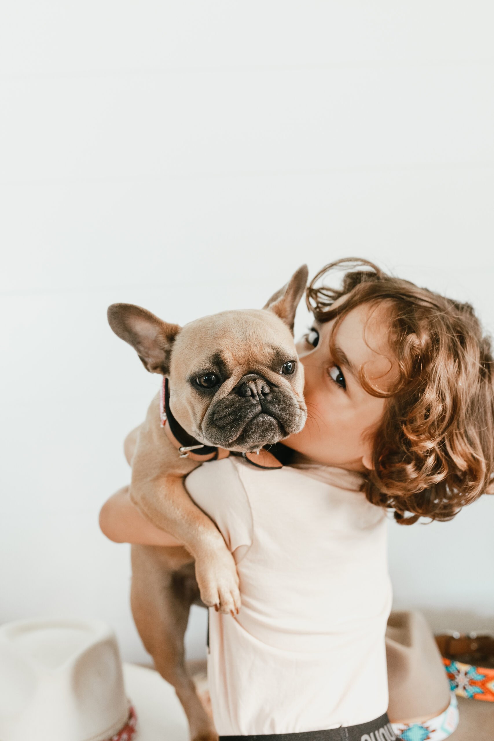 boy hugging his puppy