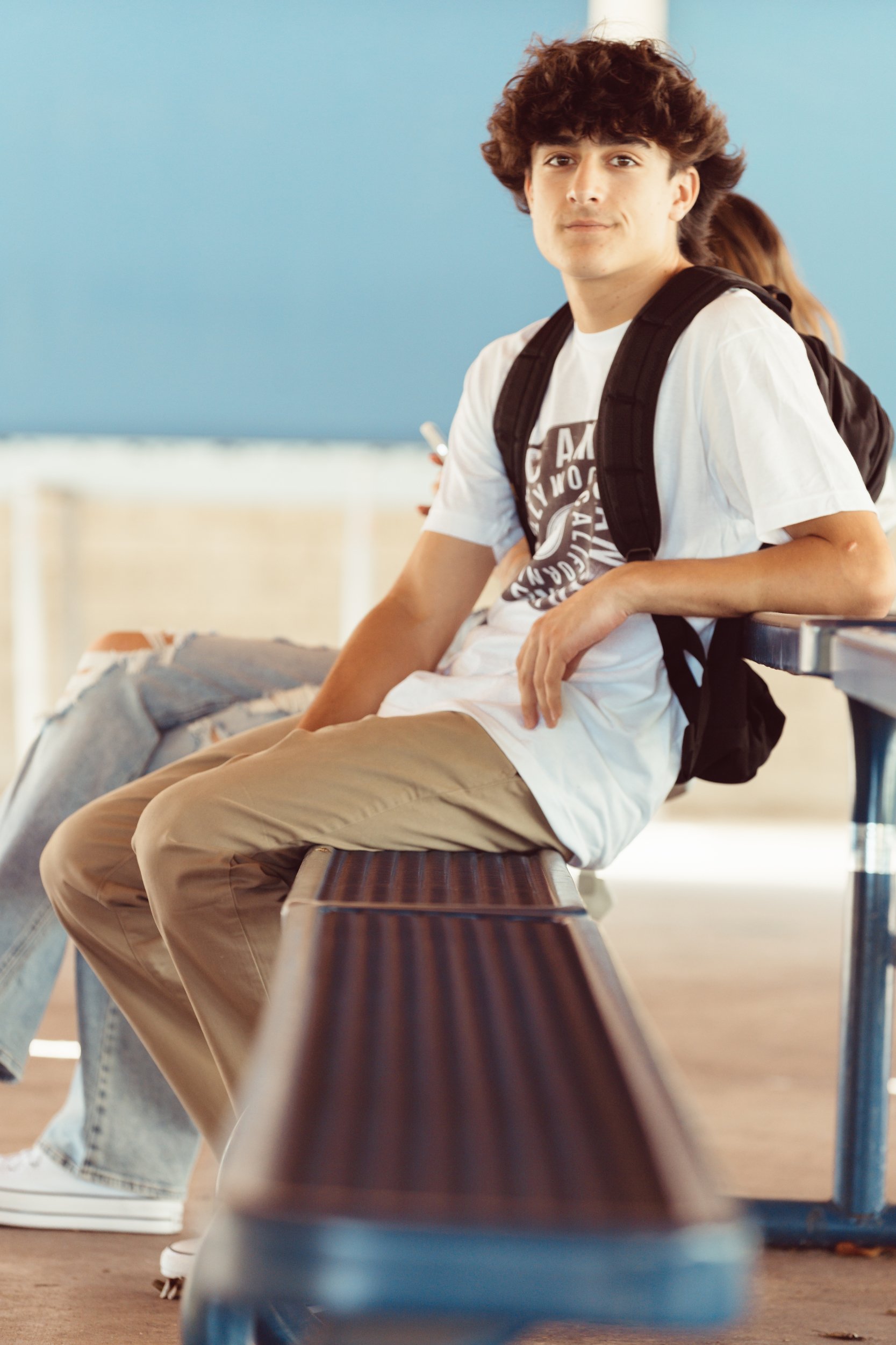 boy sitting on bench