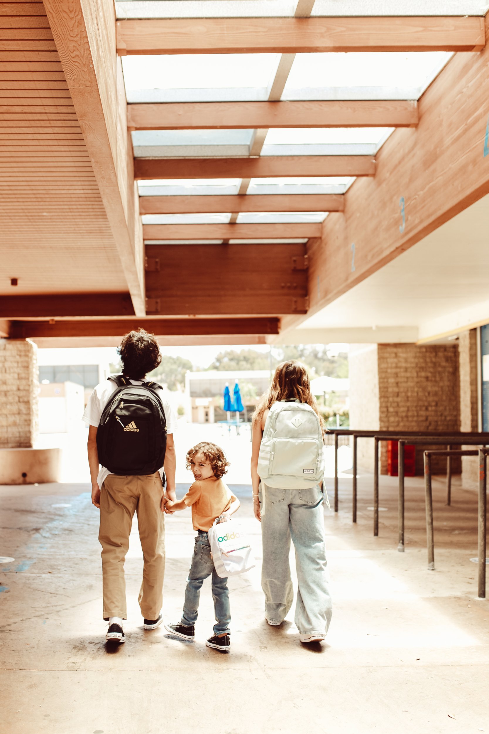 siblings walking through school