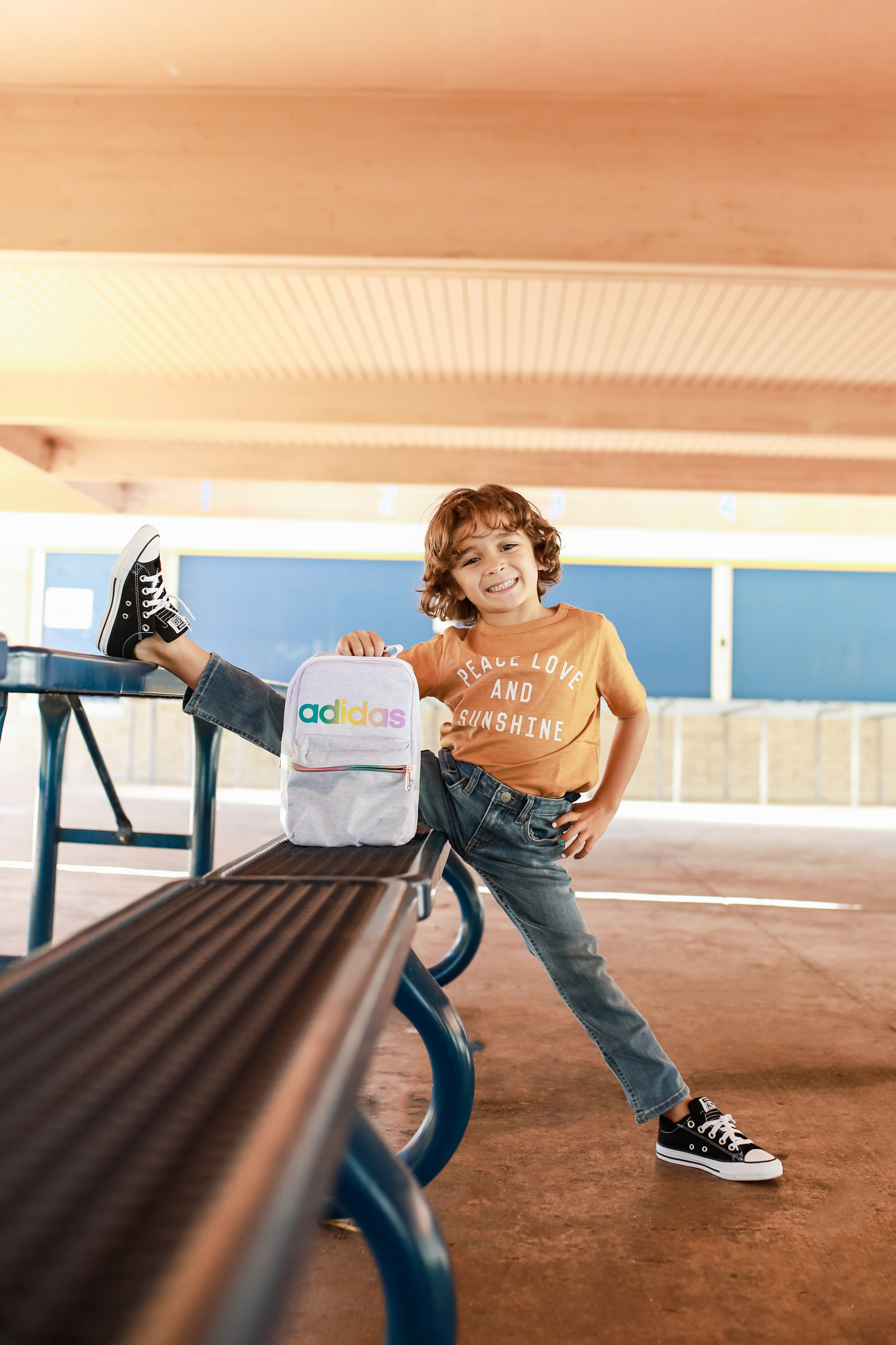 boy stretching on table