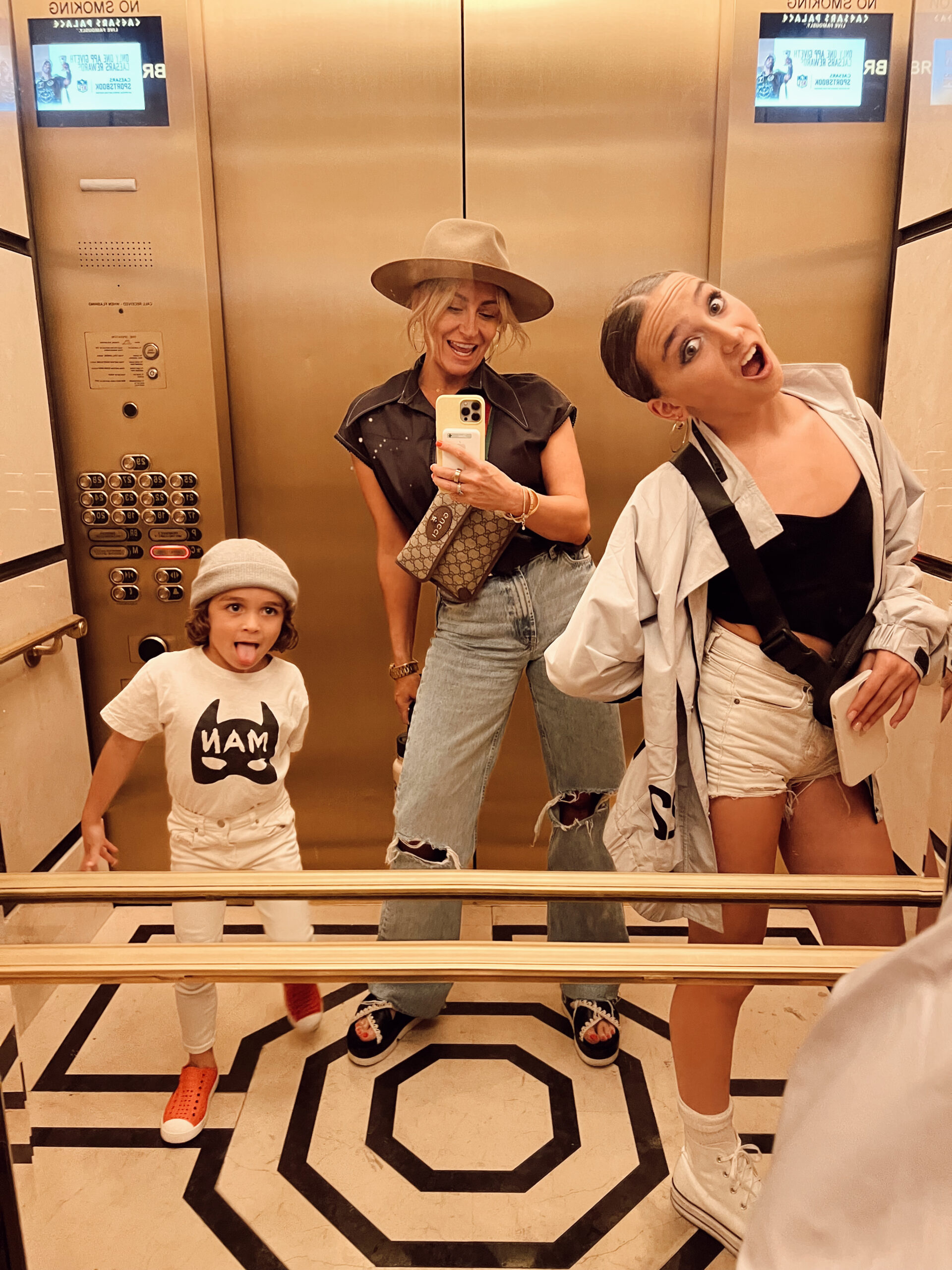 mom with kids dancing in the elevator