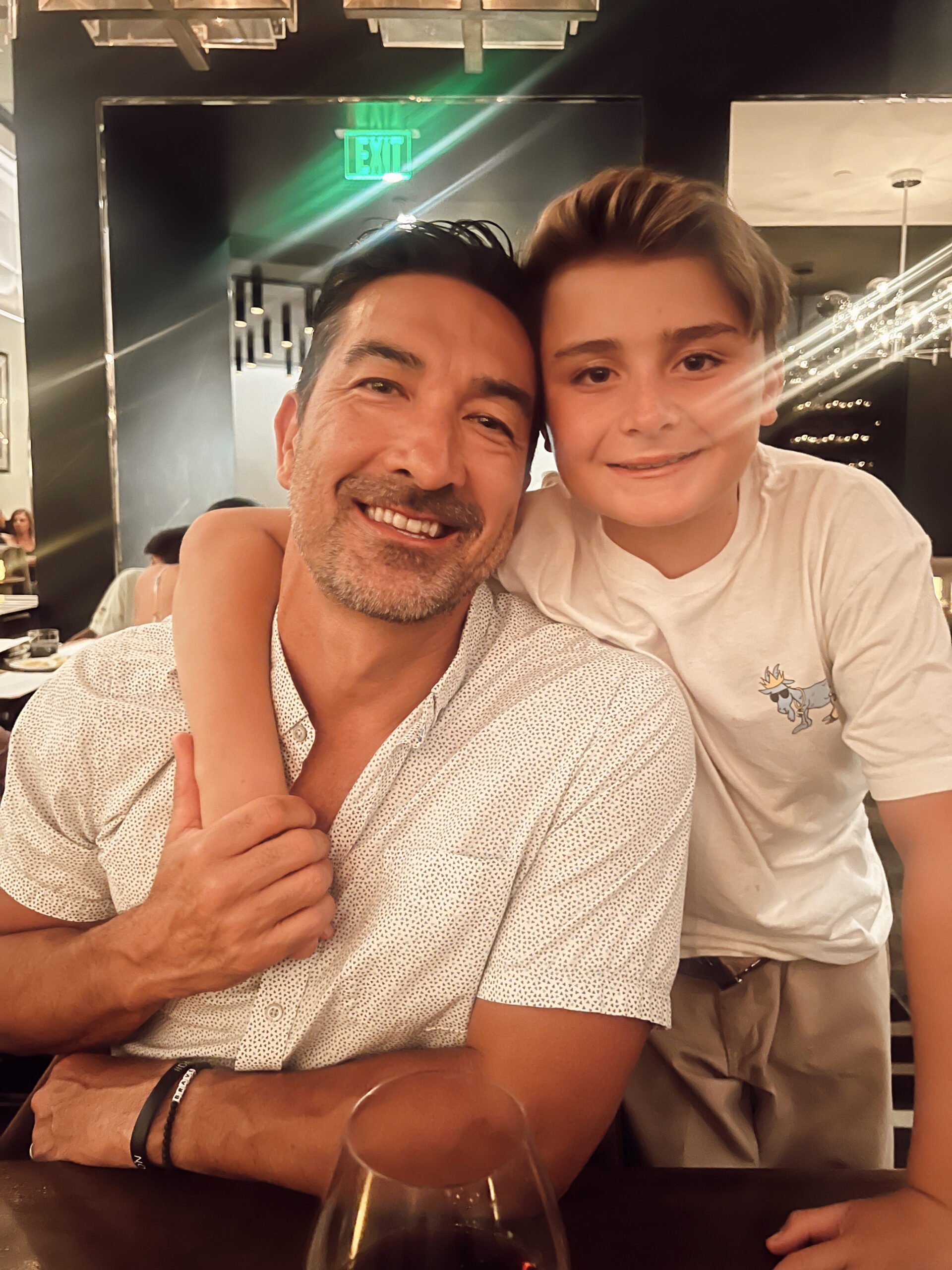 boy and his dad at restaurant