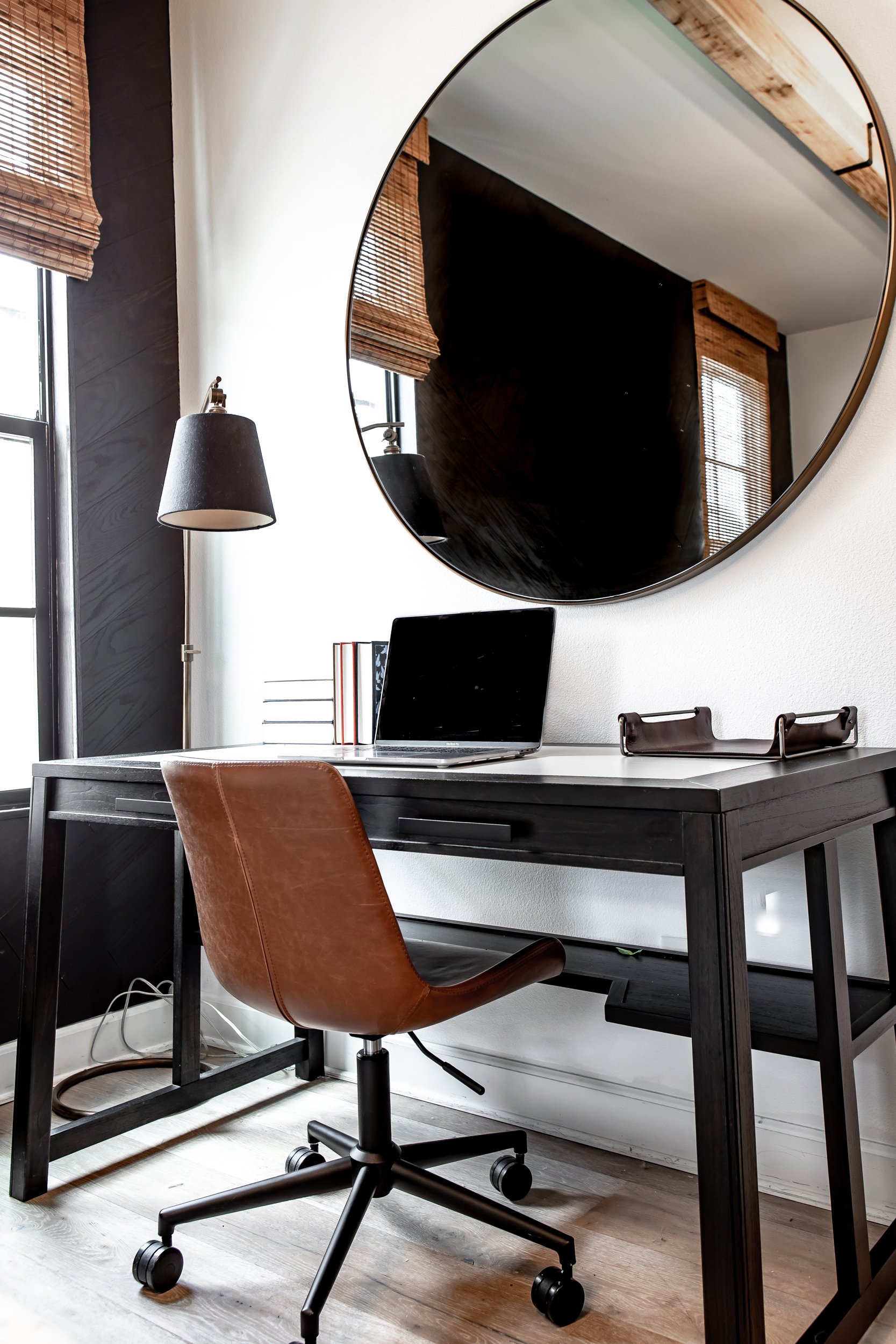 desk with mirror above it