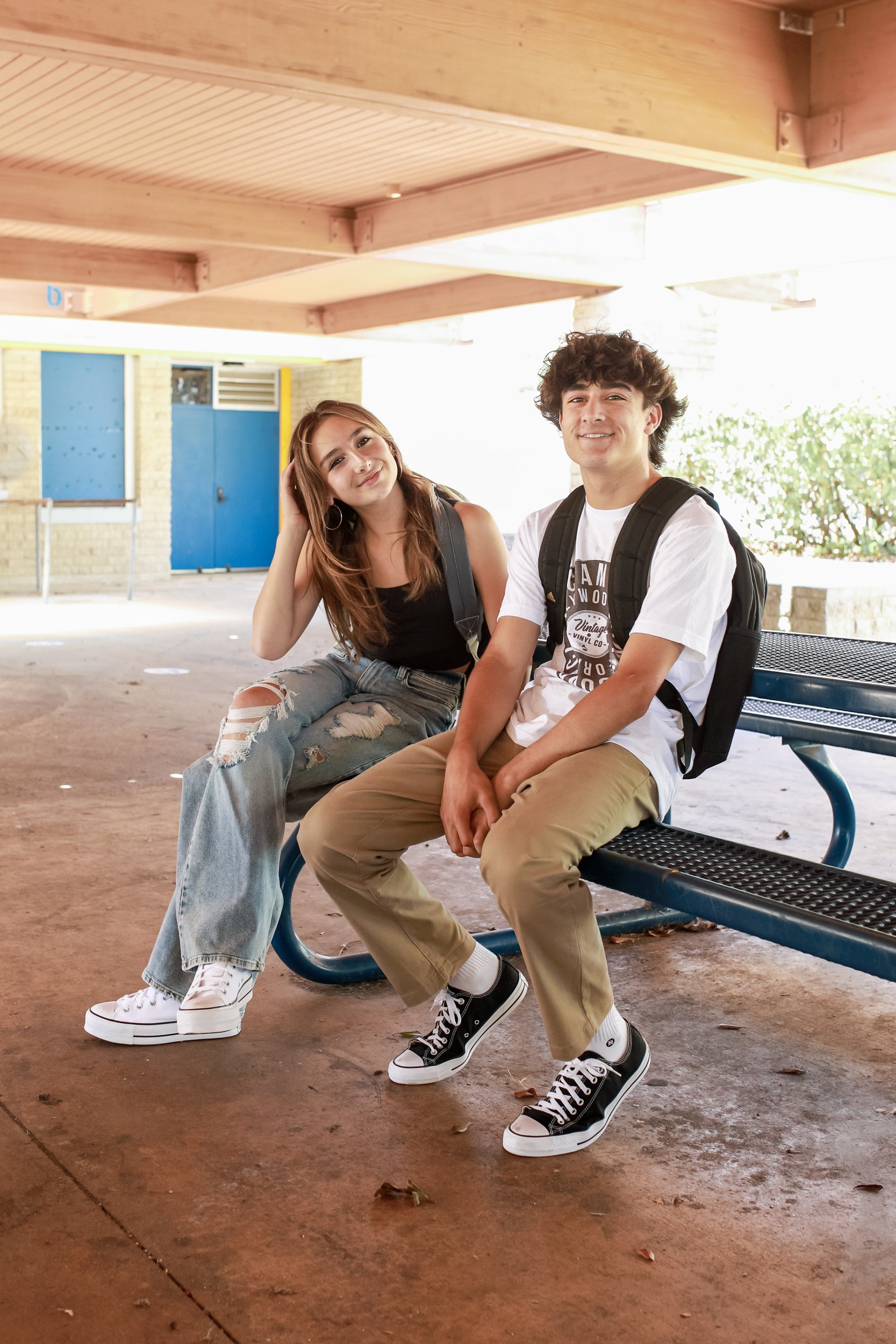 siblings sitting on a bench