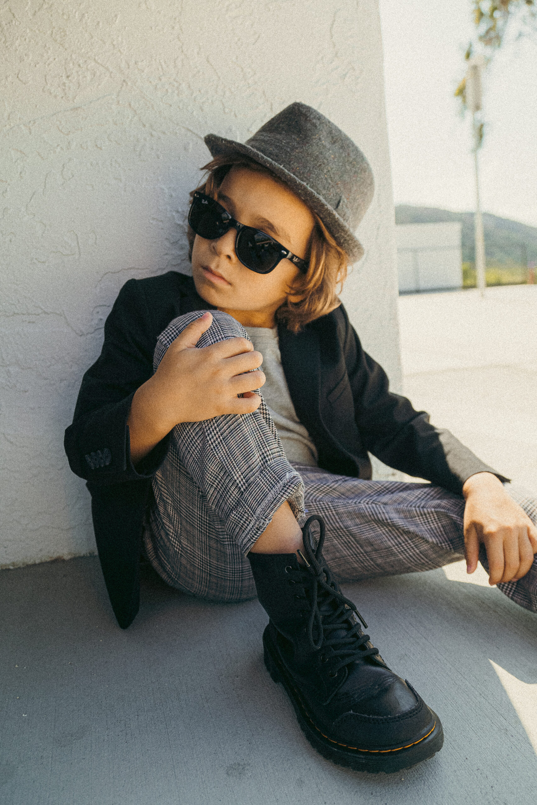 stylish kid sitting down