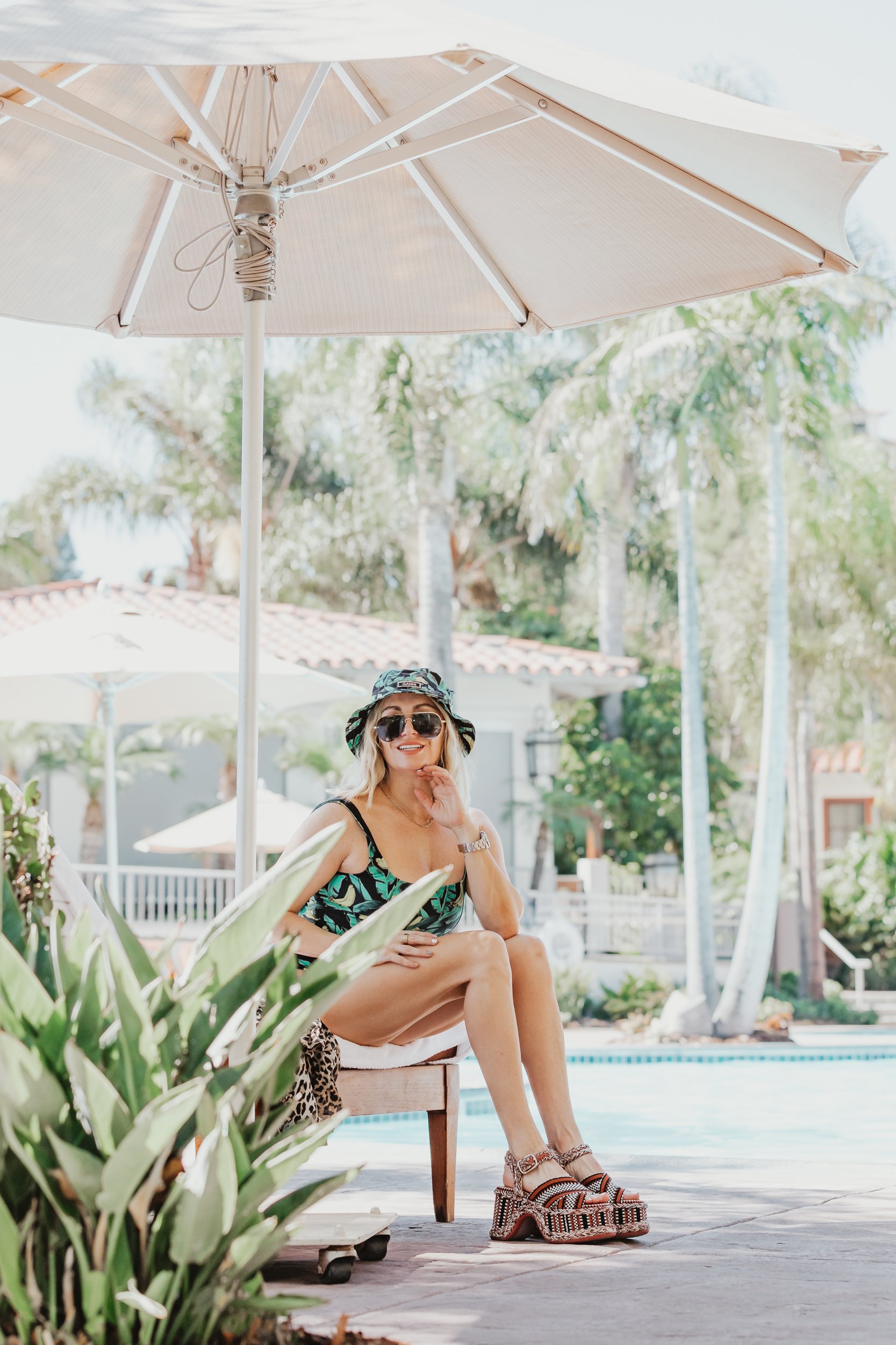 woman sitting by the pool