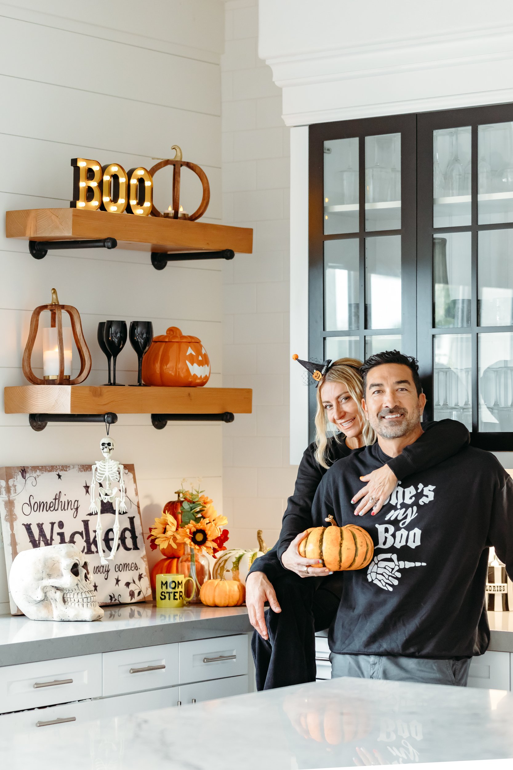 couple cuddling in kitchen together