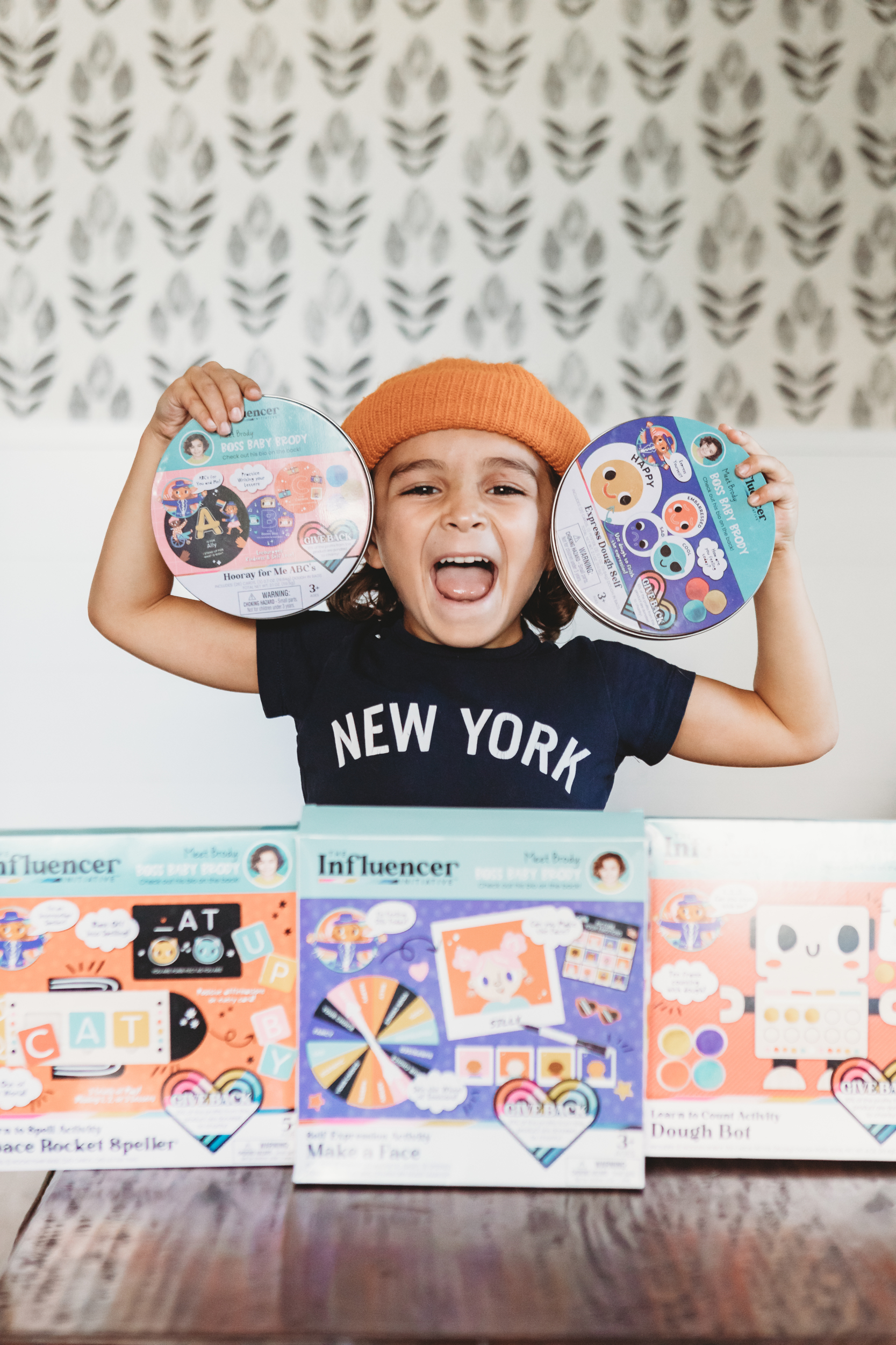 boy holding up toys