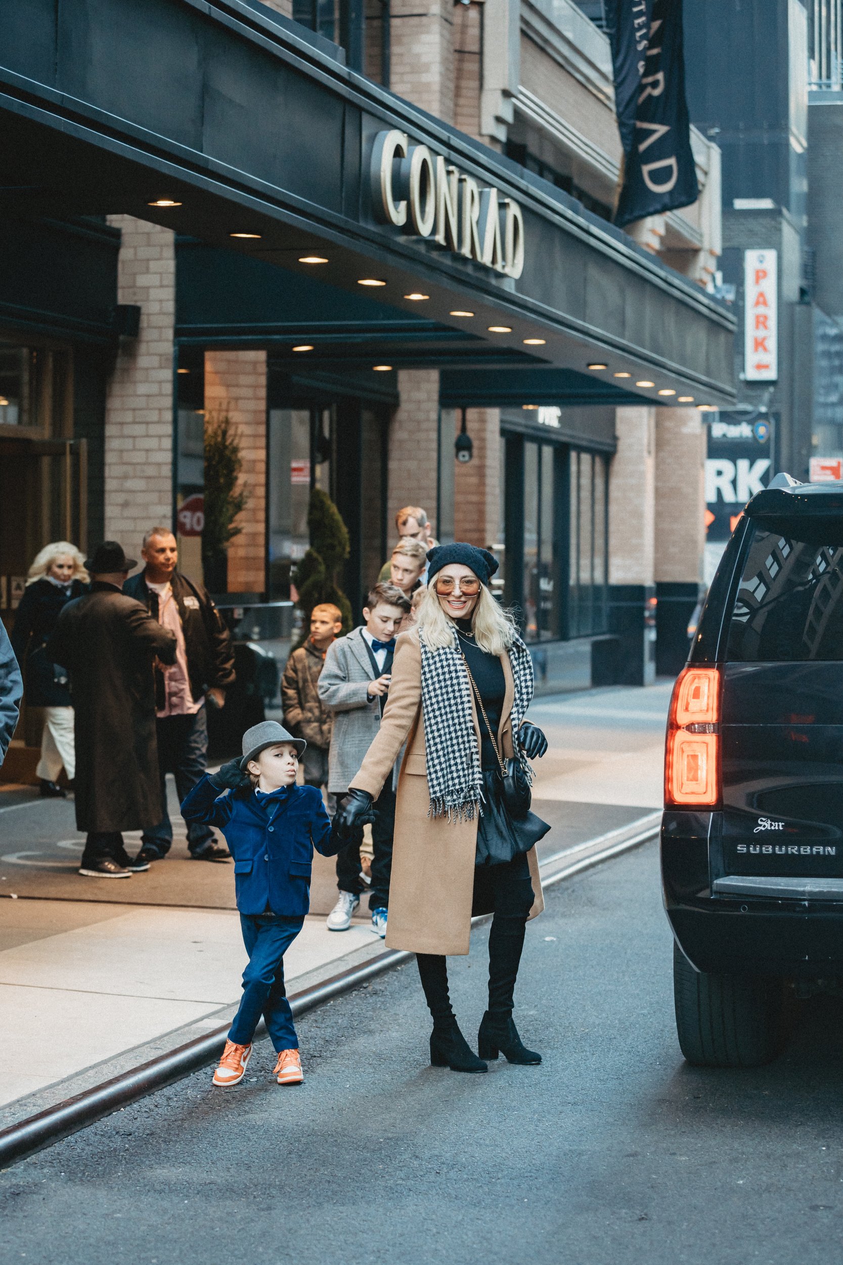 mom and son outside nyc hotel