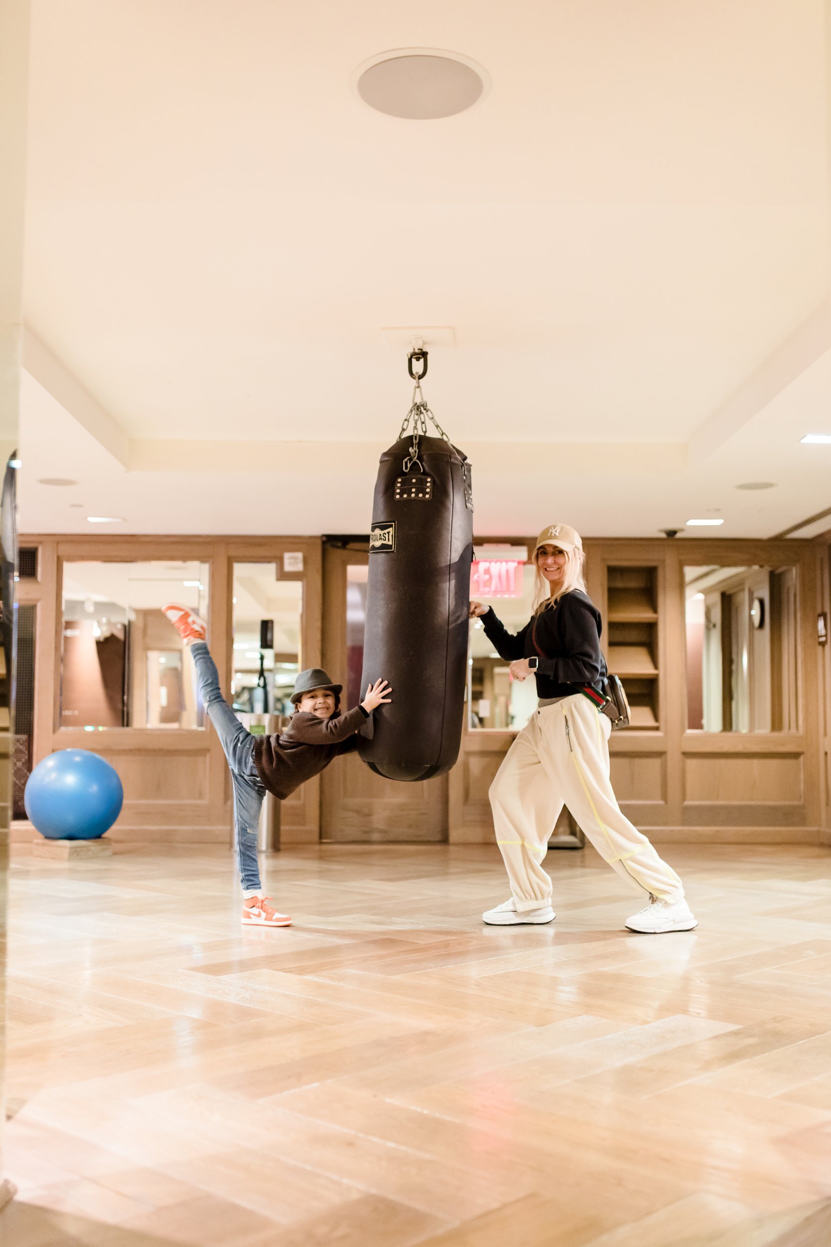 mom and son working out in gym