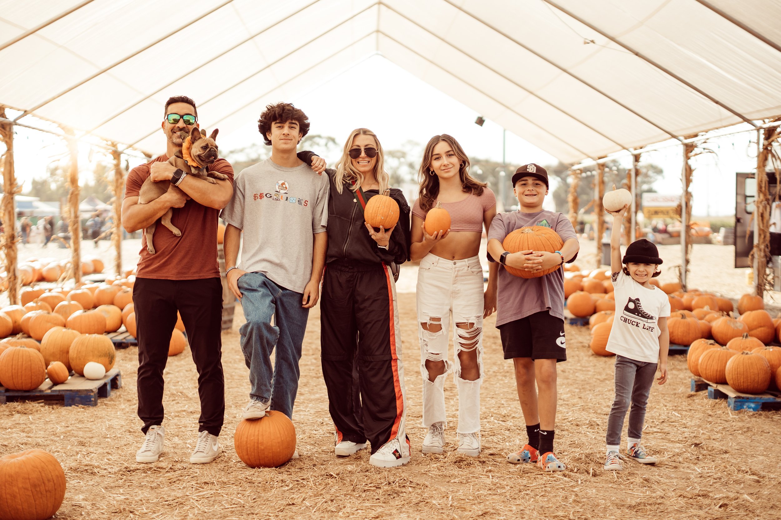 family in a pumpkin patch