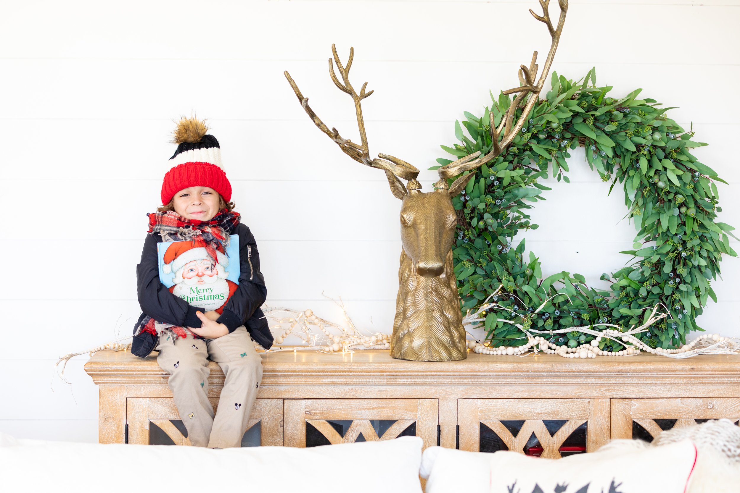 boy sitting with christmas book