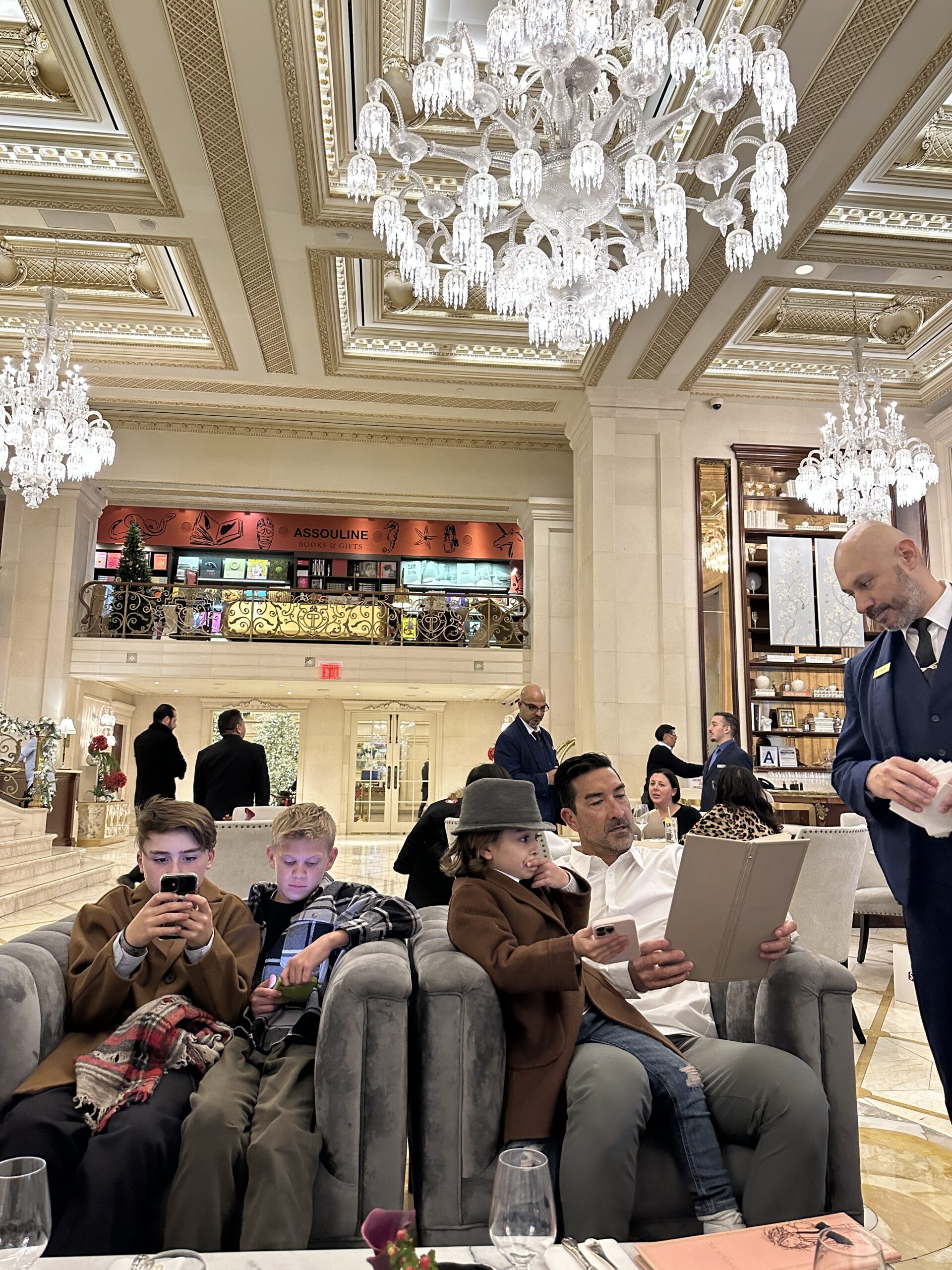 family hanging out in hotel lobby