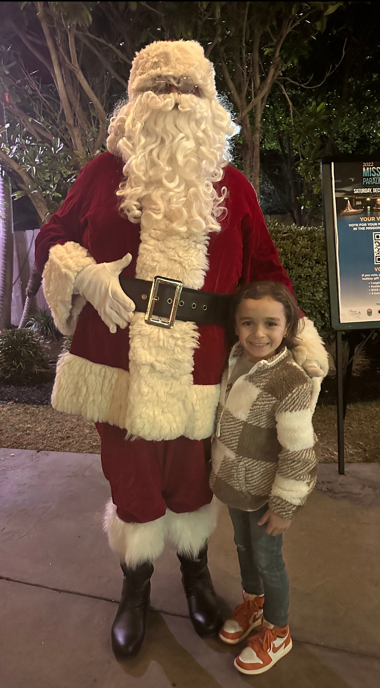 boy standing with santa