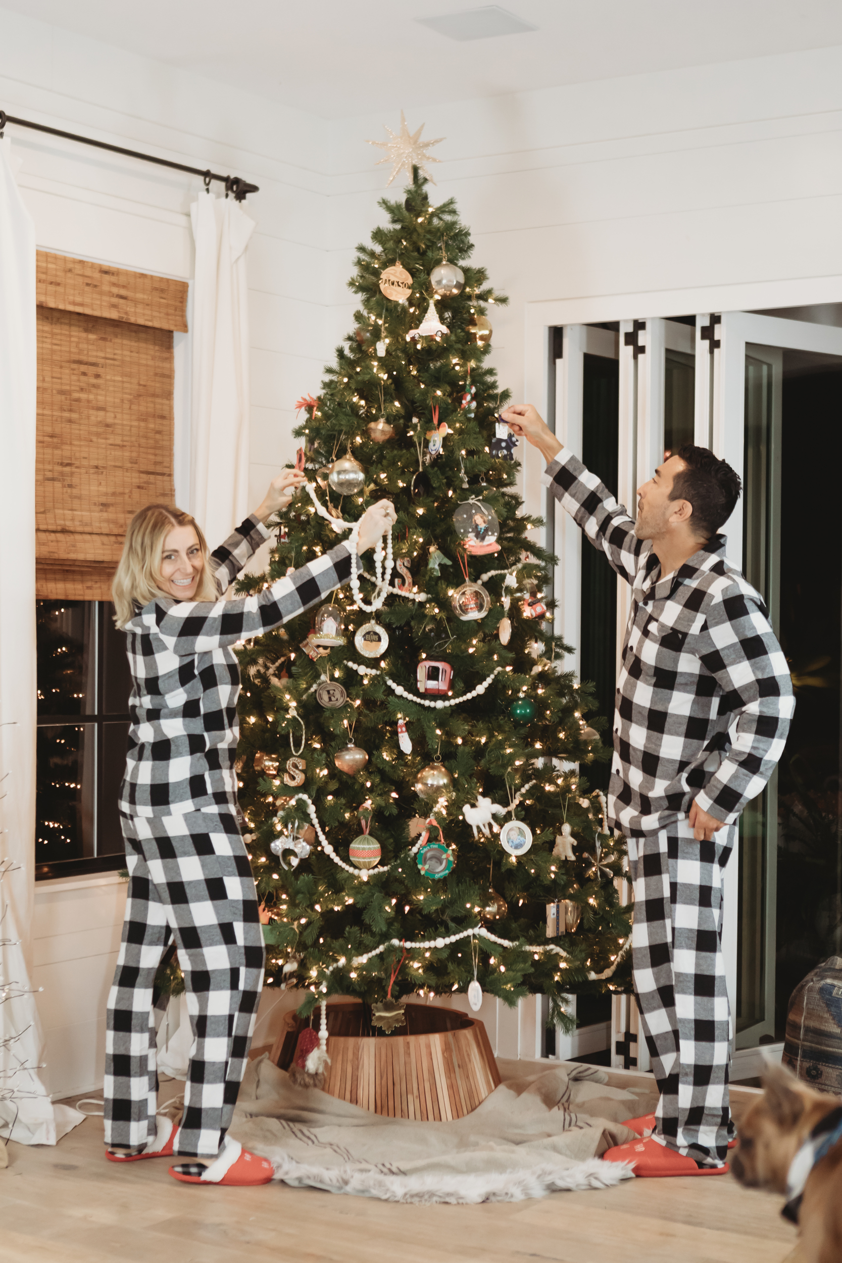 couple decorating the christmas tree