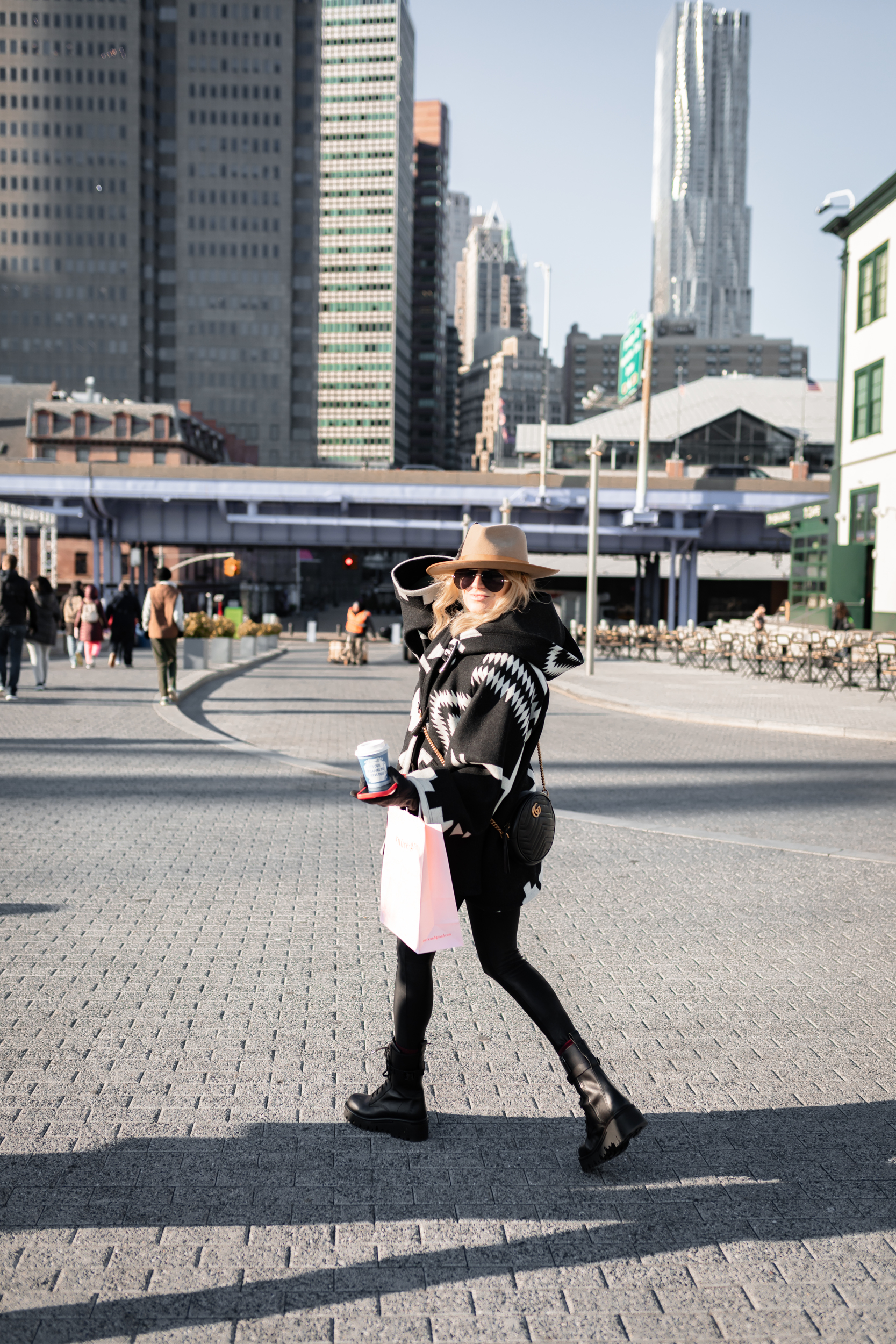 woman walking with coffee